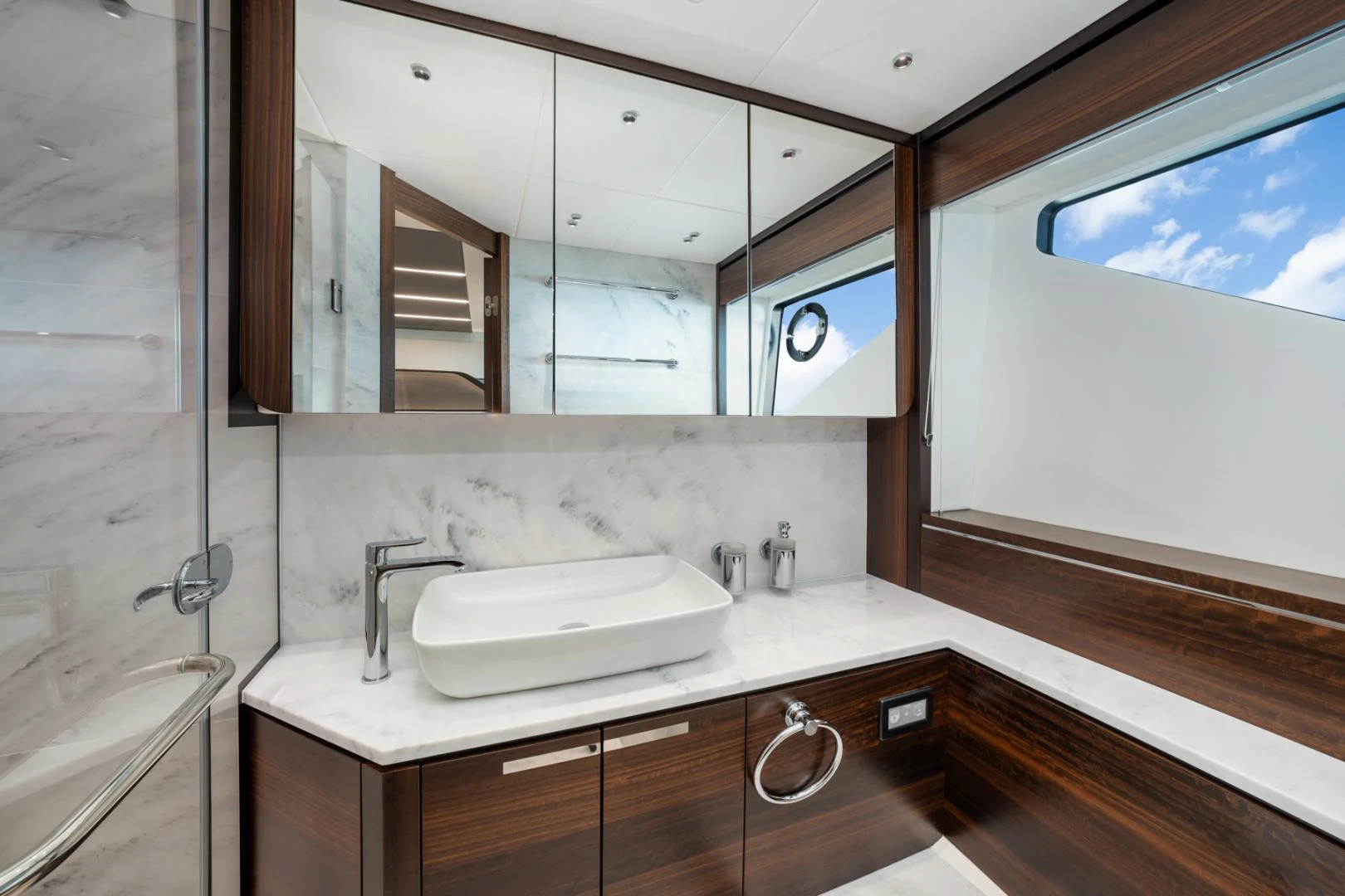a bathroom with a large mirror aboard DEALER DEMO Yacht for Sale