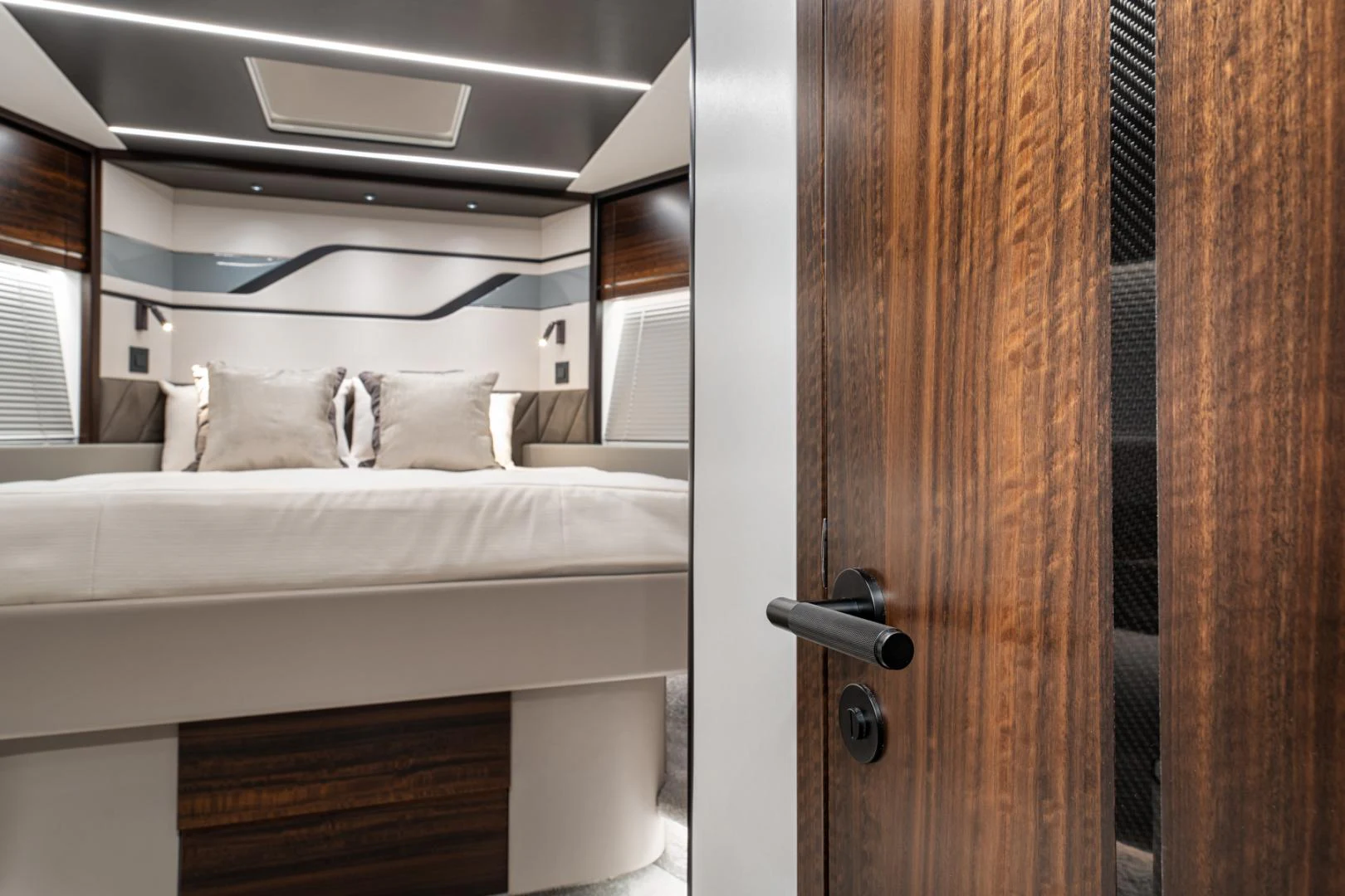 a cat peeking out from a door aboard DEALER DEMO Yacht for Sale