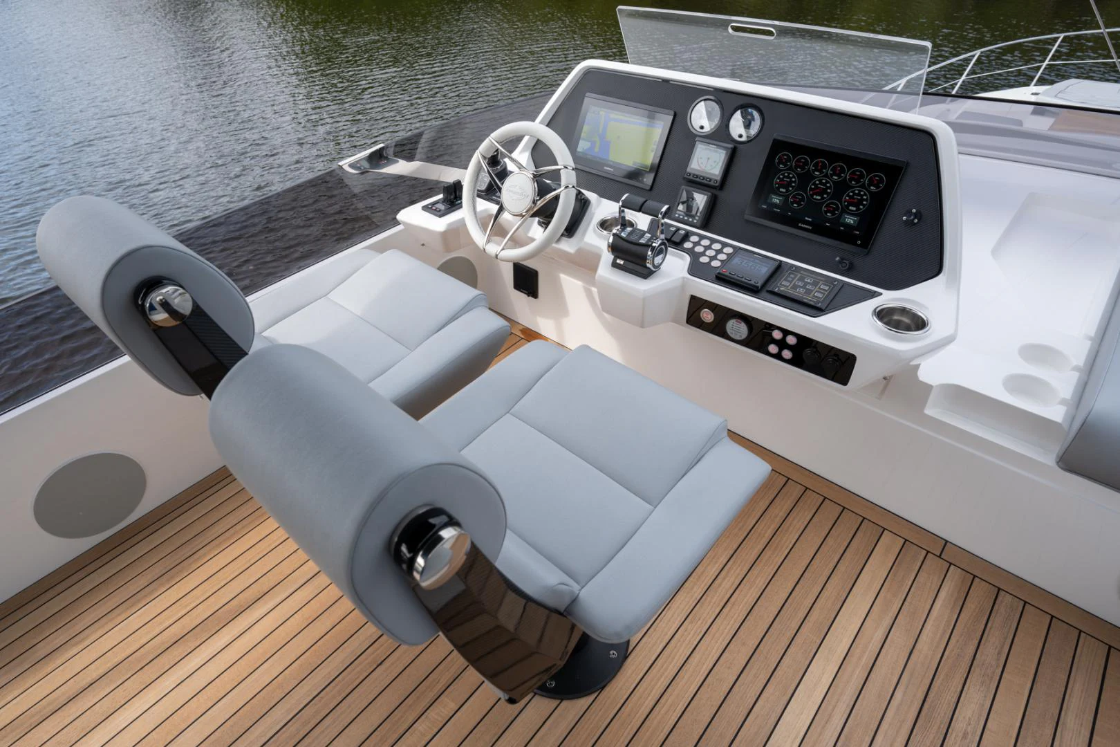 a car with a steering wheel aboard DEALER DEMO Yacht for Sale