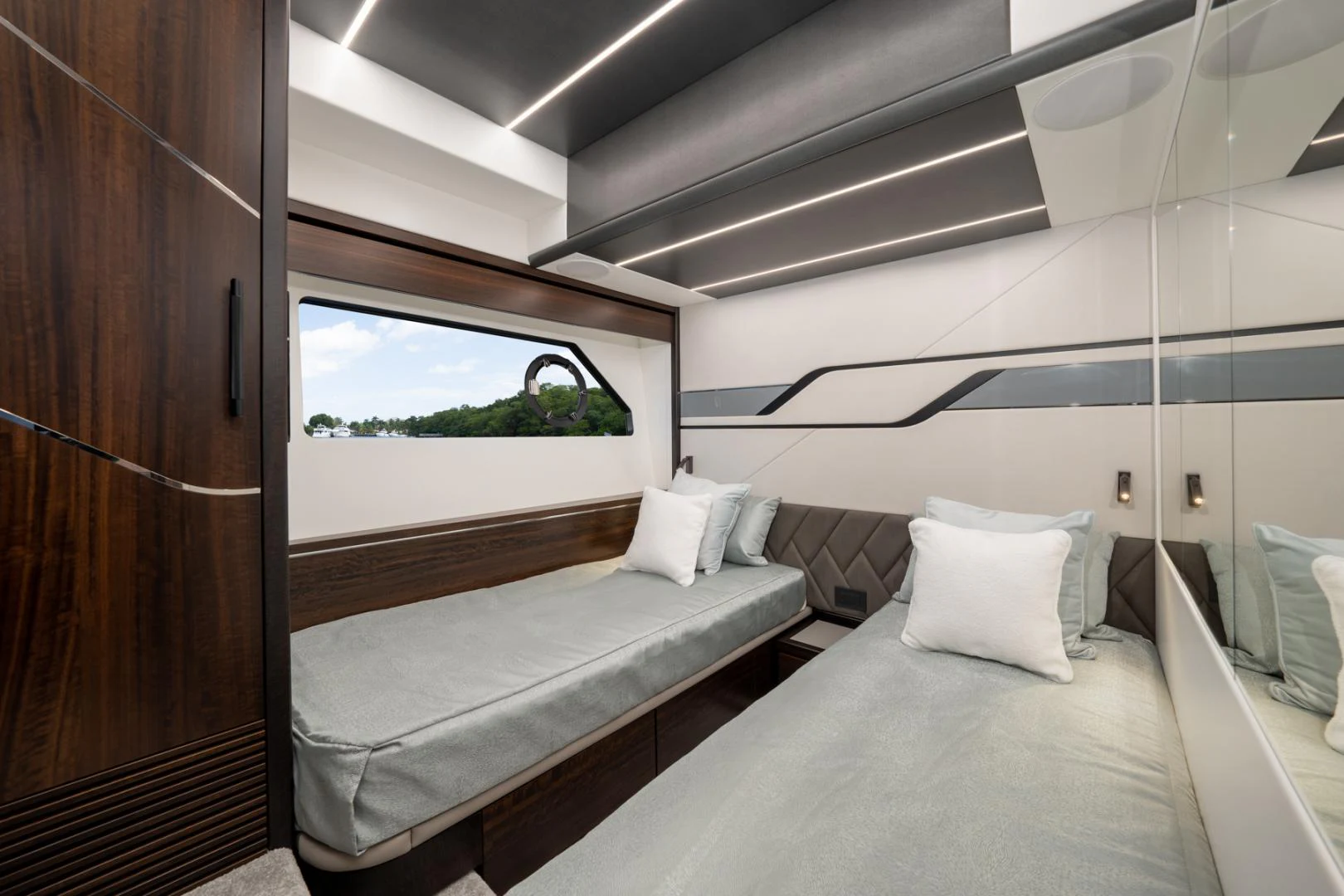 a room with a bed and a window aboard DEALER DEMO Yacht for Sale