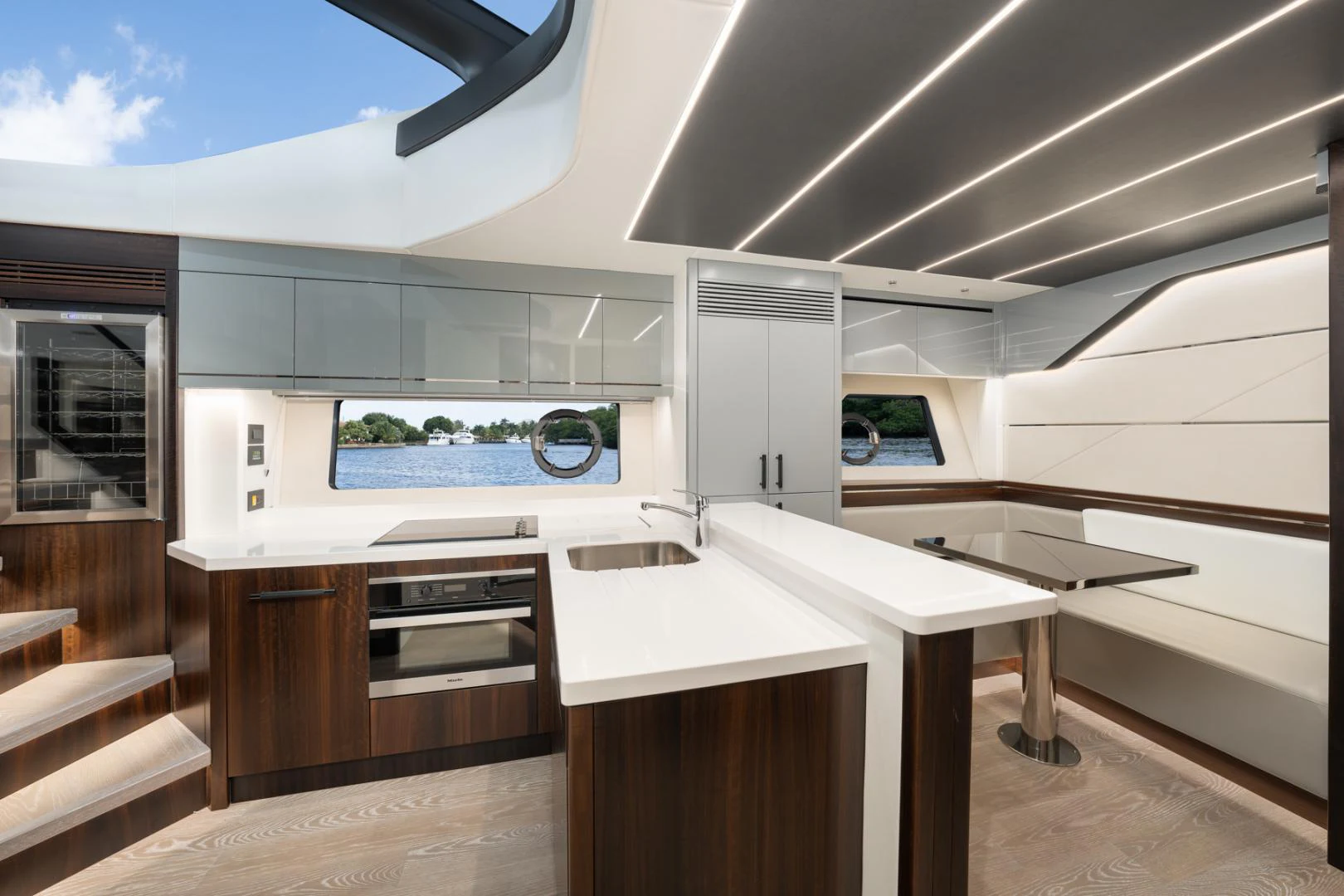 a modern kitchen with a large window aboard DEALER DEMO Yacht for Sale