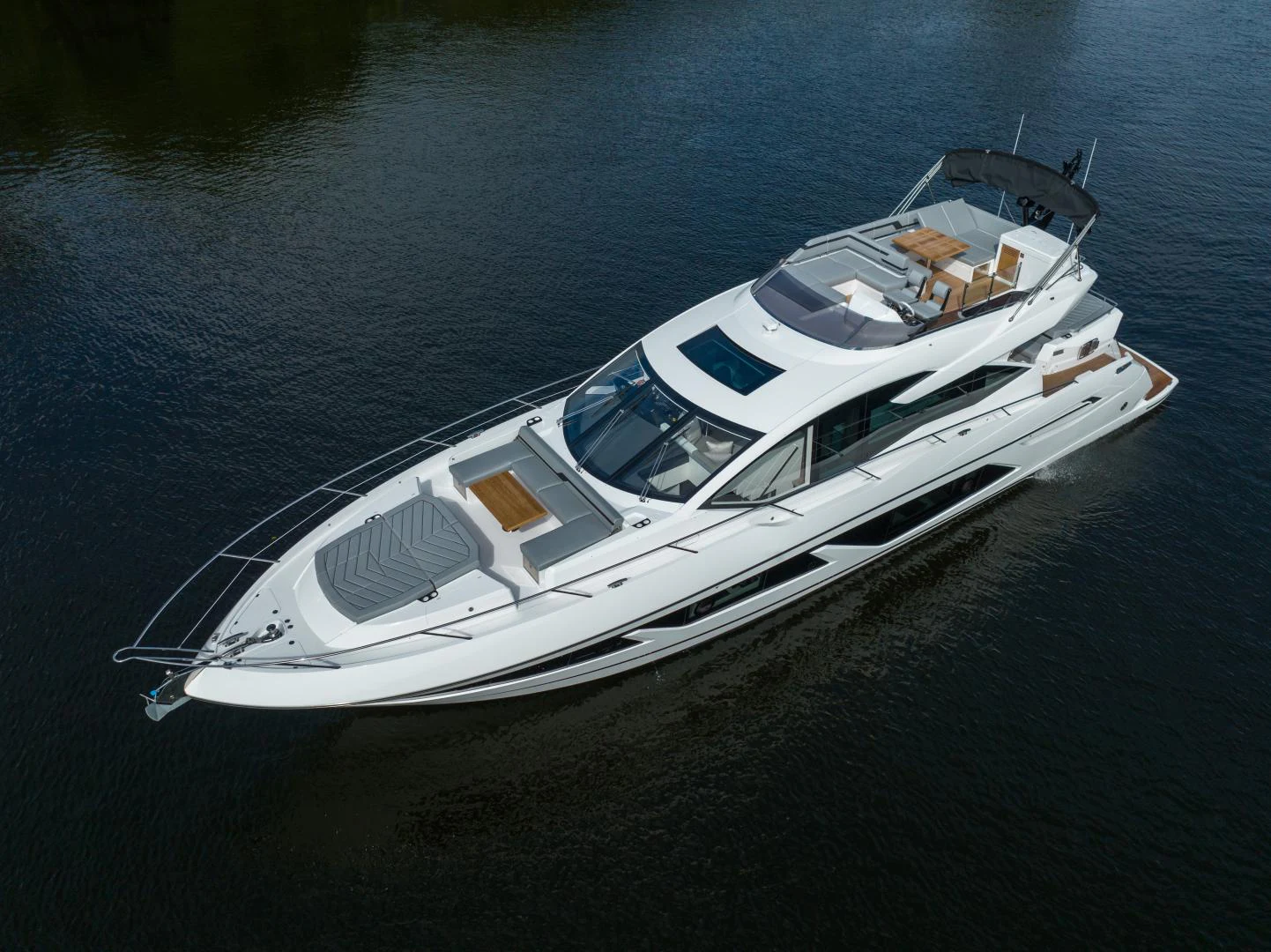 a white boat on water aboard DEALER DEMO Yacht for Sale