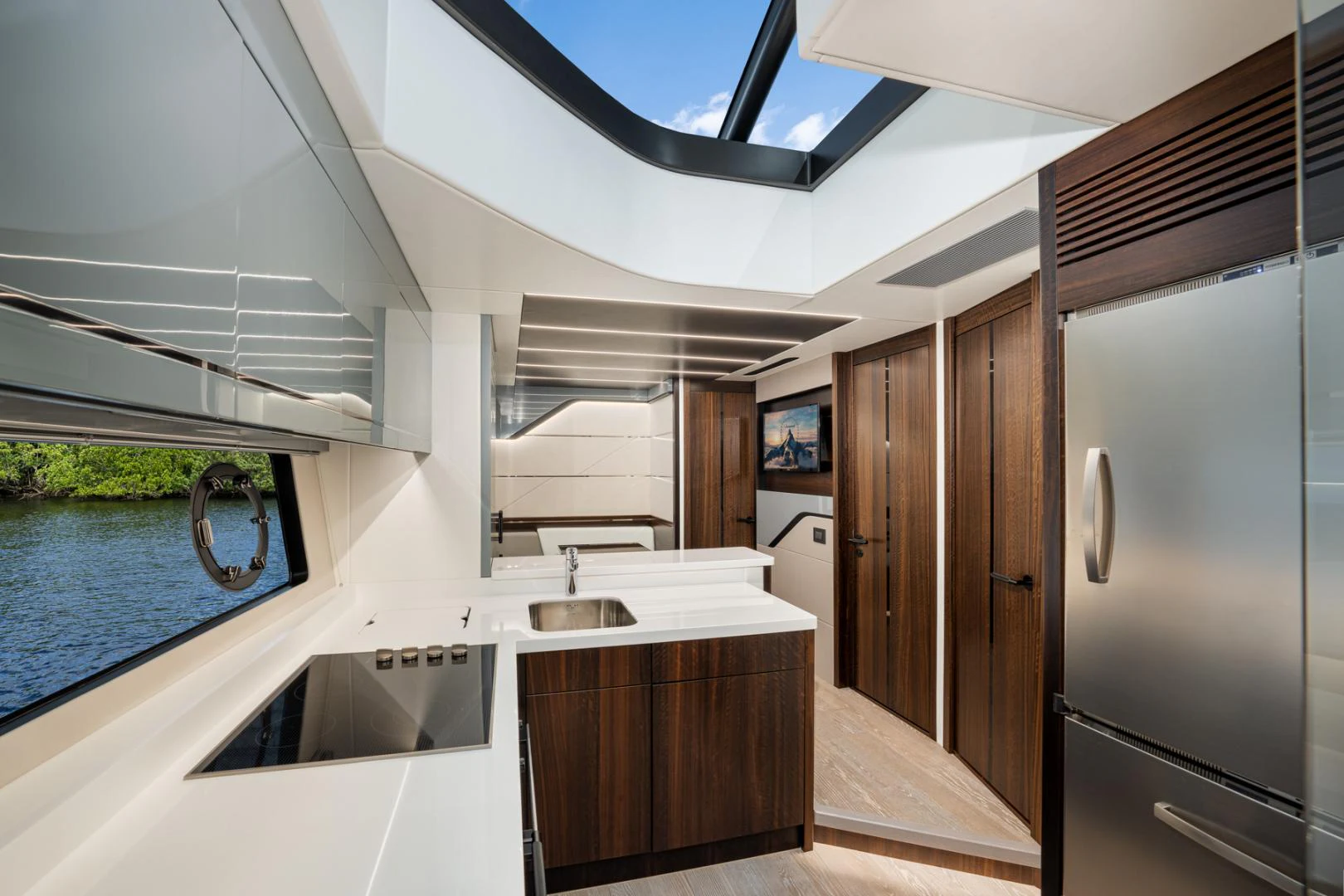 a modern kitchen with a pool aboard DEALER DEMO Yacht for Sale