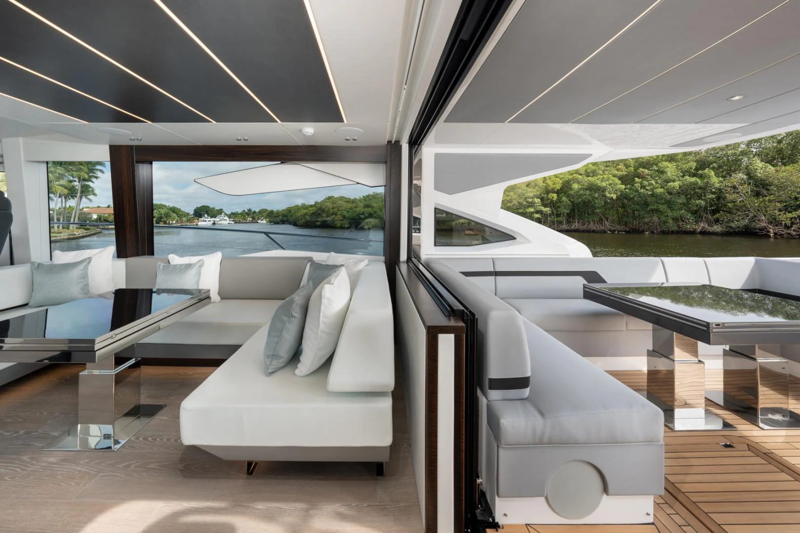 a room with a view of the water and the land aboard DEALER DEMO Yacht for Sale