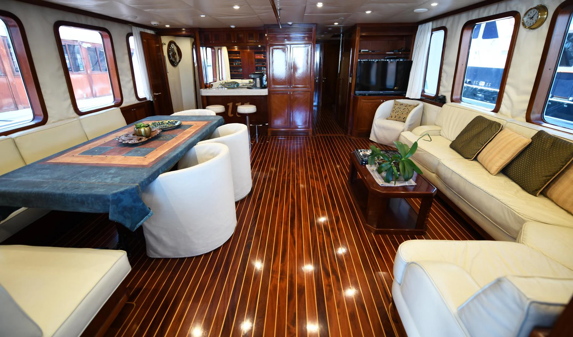 a room with a table and chairs aboard AMARELLA F Yacht for Sale