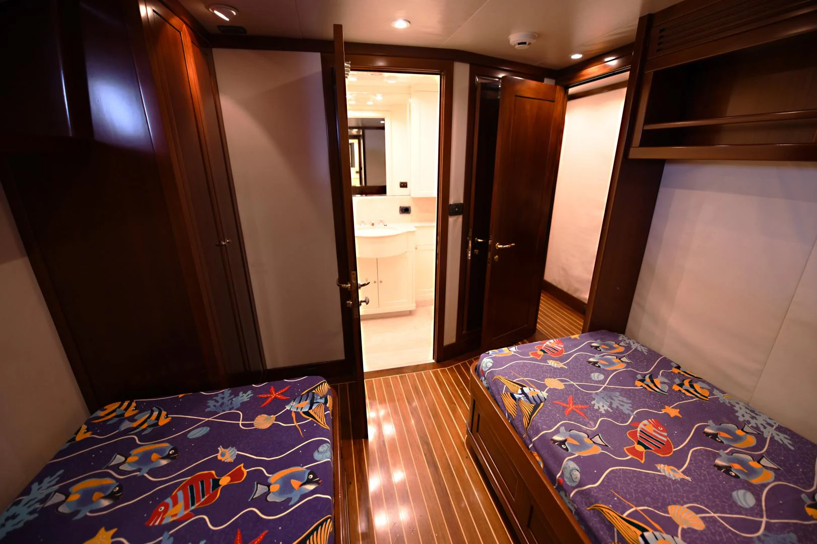 a bedroom with a bed and a closet aboard AMARELLA F Yacht for Sale