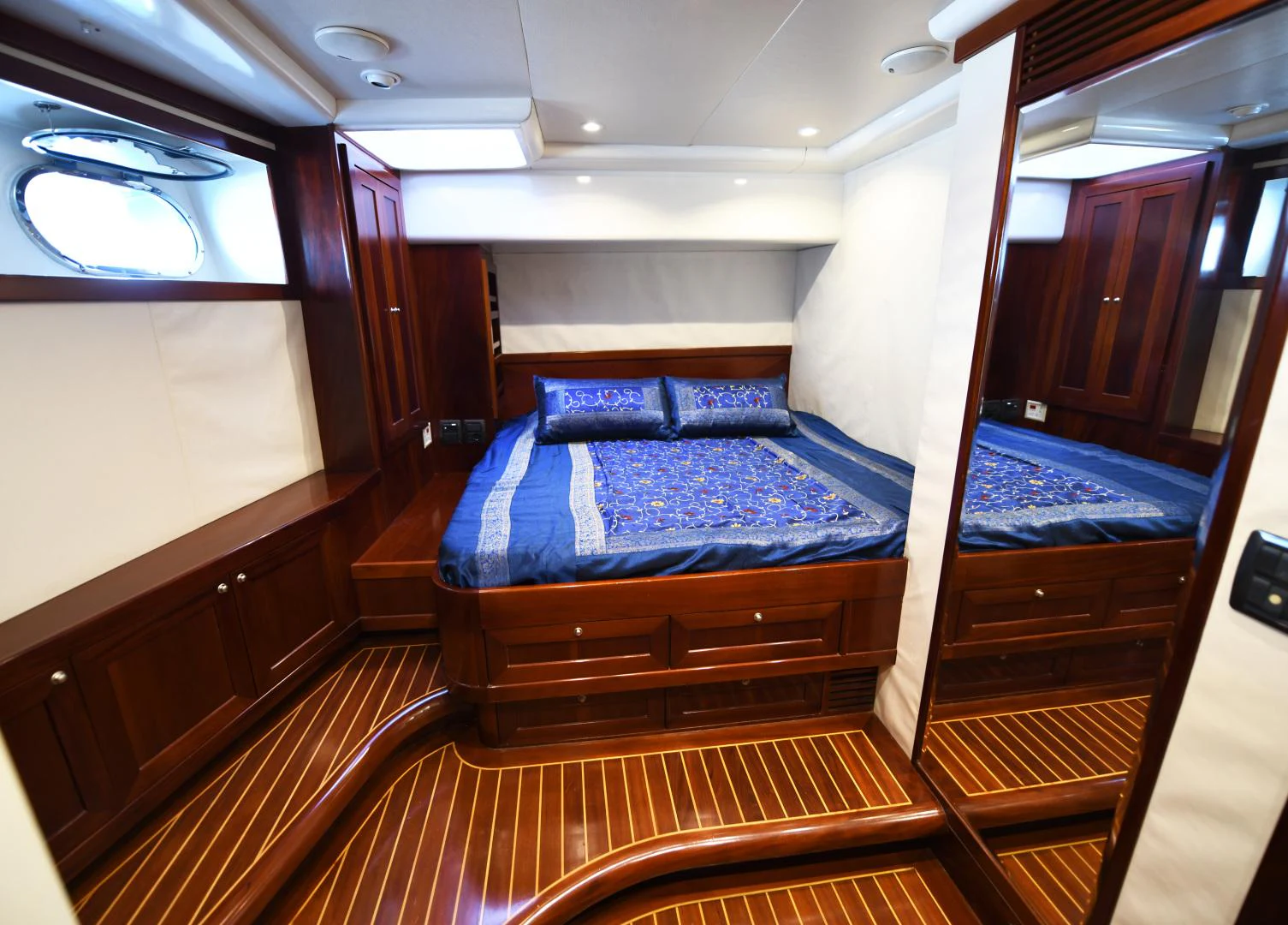a bed in a room aboard AMARELLA F Yacht for Sale