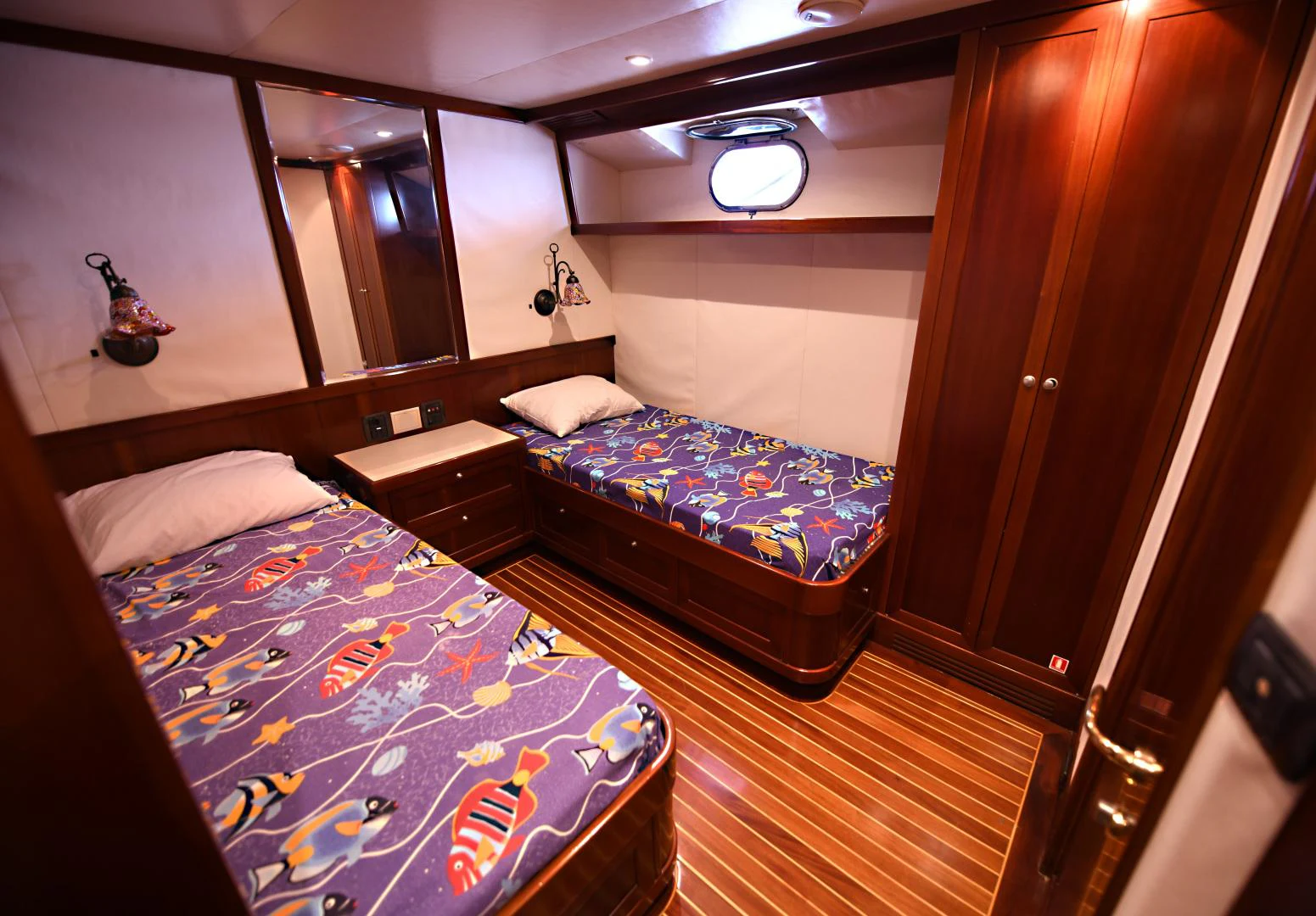a room with two beds aboard AMARELLA F Yacht for Sale