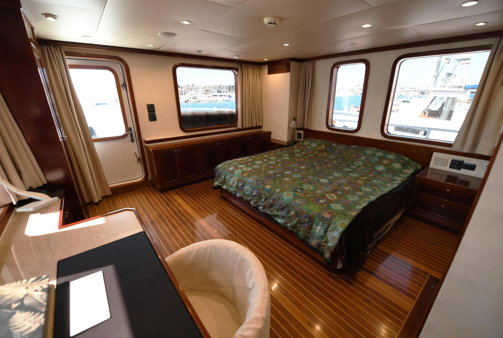 a room with a bed and a desk aboard AMARELLA F Yacht for Sale