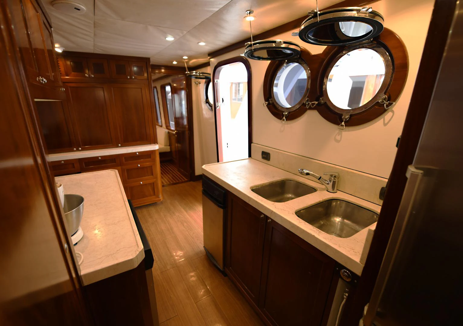 a kitchen with sinks and mirrors aboard AMARELLA F Yacht for Sale