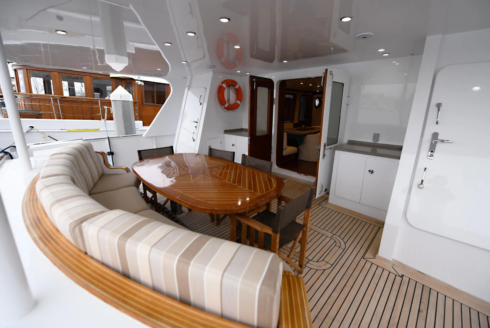a living room with a couch and a table aboard AMARELLA F Yacht for Sale