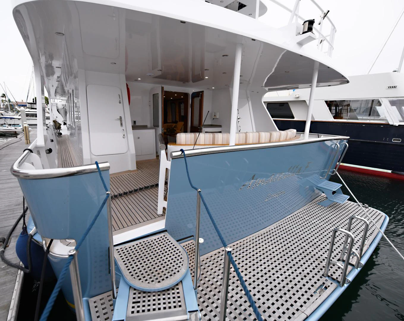 a boat with a chair and a table on it aboard AMARELLA F Yacht for Sale
