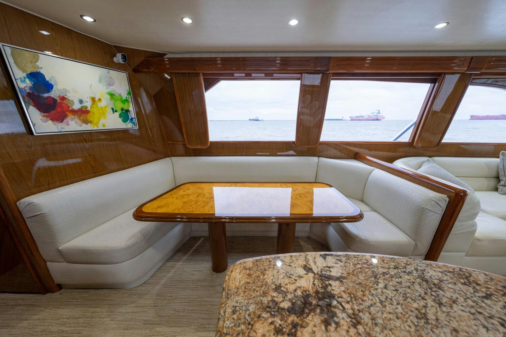 a room with a table and chairs aboard MM CRICKET Yacht for Sale