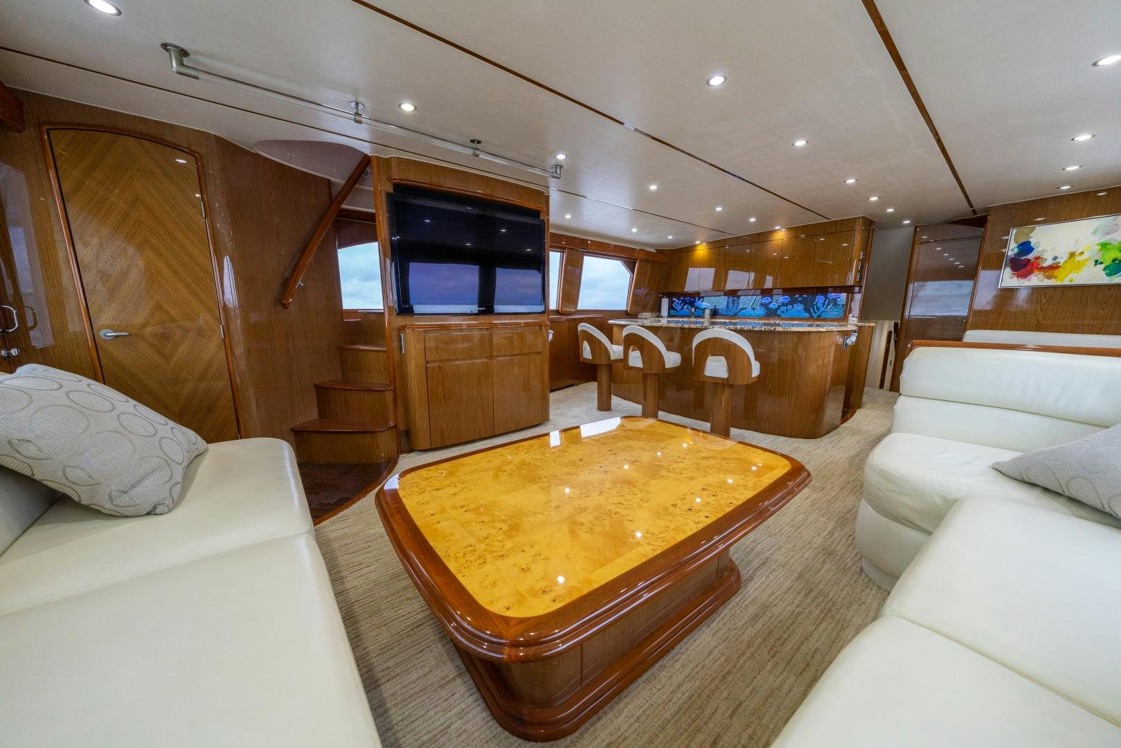 a room with a table and couches aboard MM CRICKET Yacht for Sale