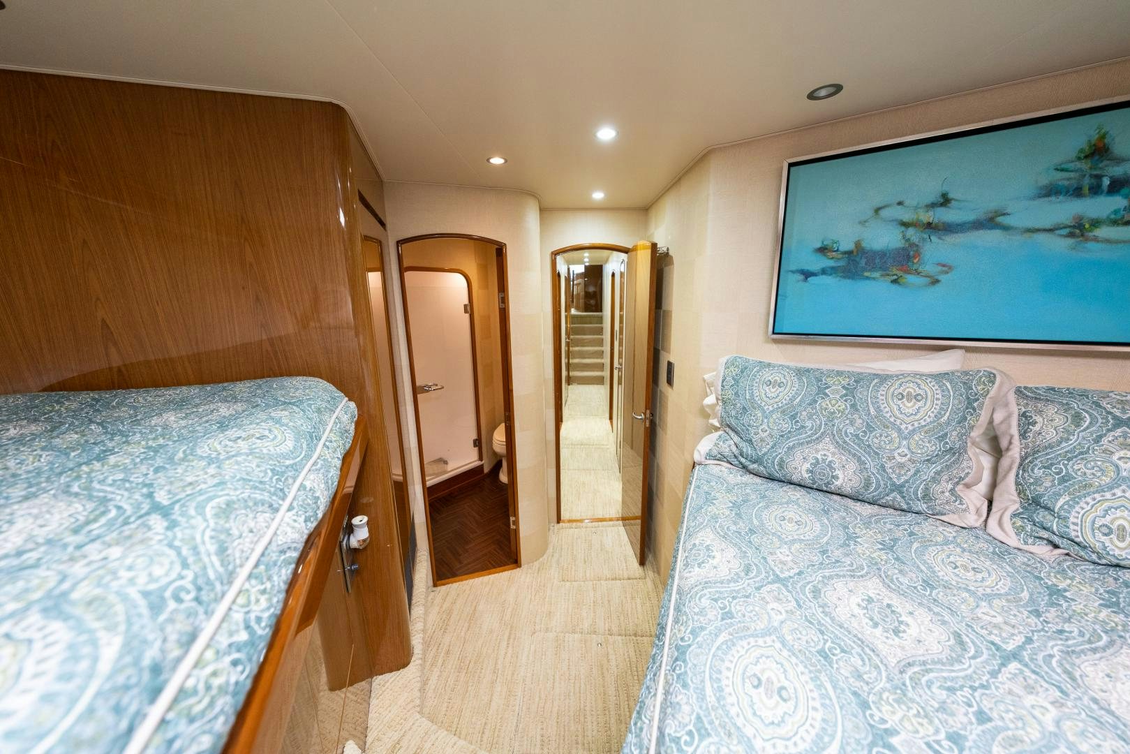 a bedroom with a couple of beds aboard MM CRICKET Yacht for Sale