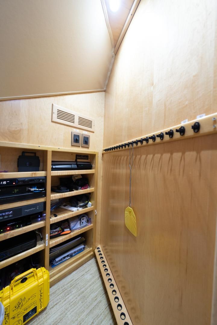 a wooden wall with wires aboard MM CRICKET Yacht for Sale