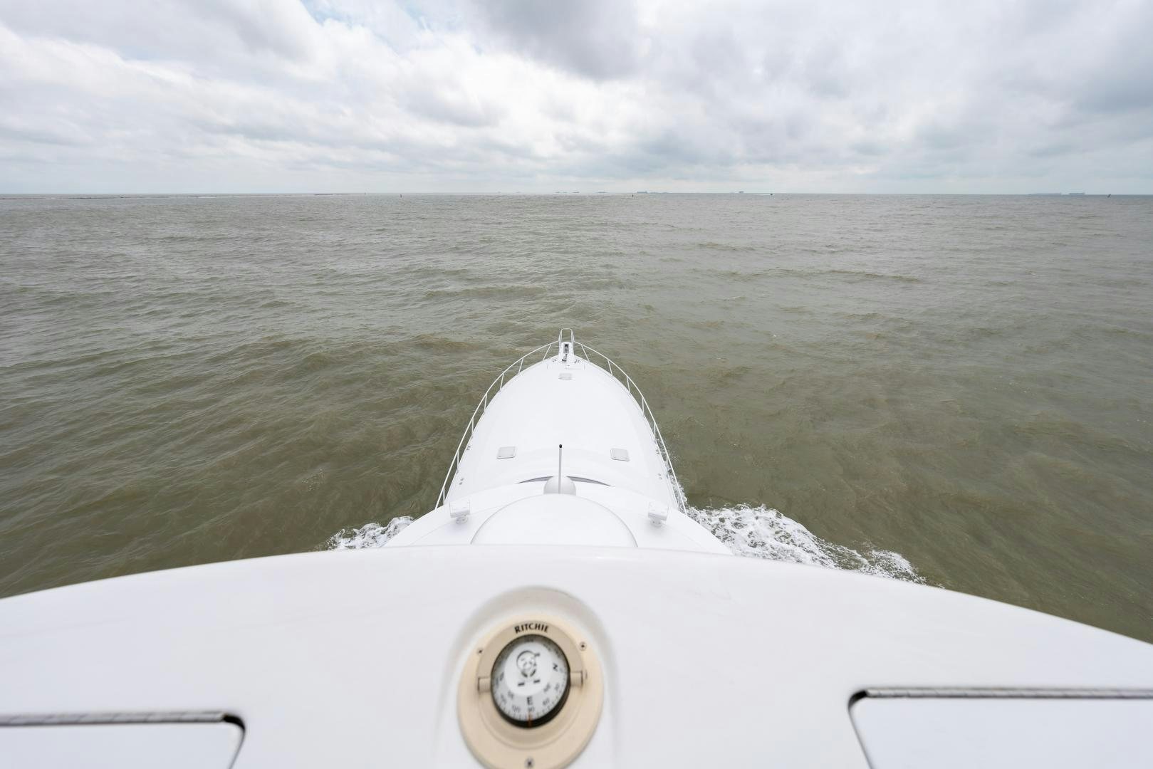 a white boat in the water aboard MM CRICKET Yacht for Sale