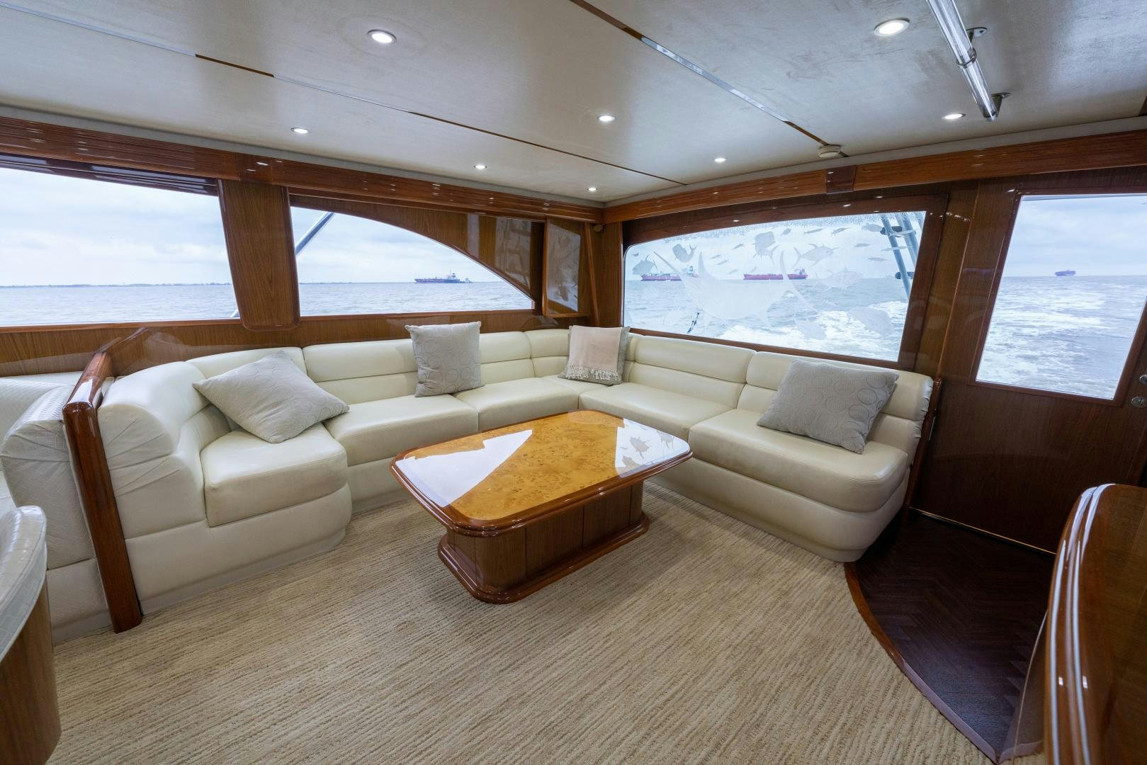a living room with a couch and a table aboard MM CRICKET Yacht for Sale