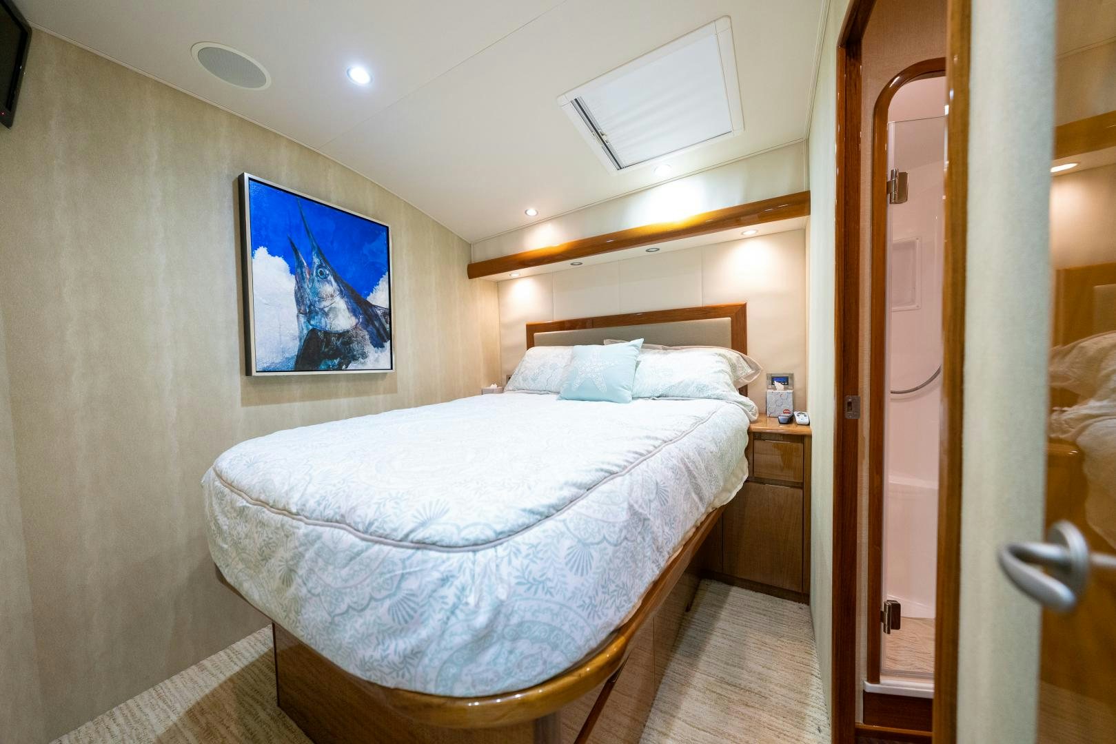 a bed in a room aboard MM CRICKET Yacht for Sale
