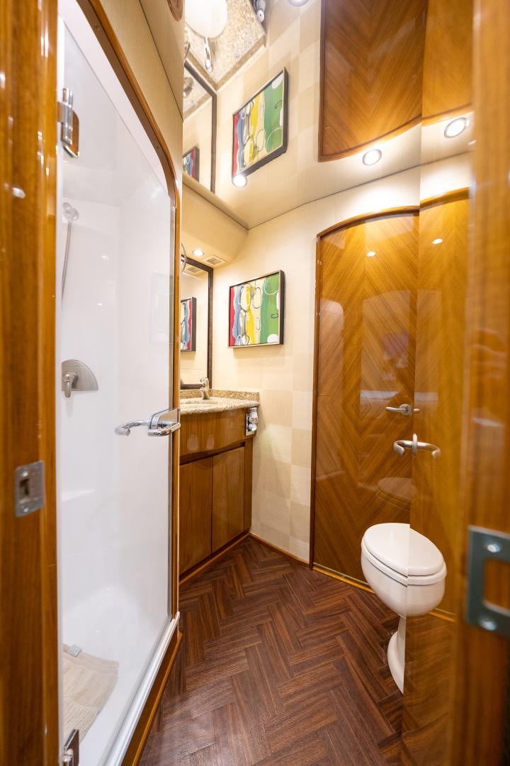 a bathroom with a toilet and a sink aboard MM CRICKET Yacht for Sale