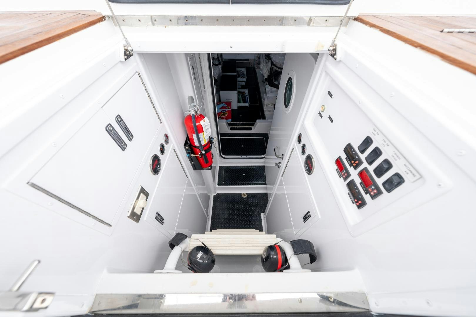 a white vehicle with a red light aboard MM CRICKET Yacht for Sale