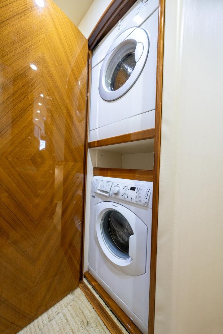 a washer and dryer in a room aboard MM CRICKET Yacht for Sale