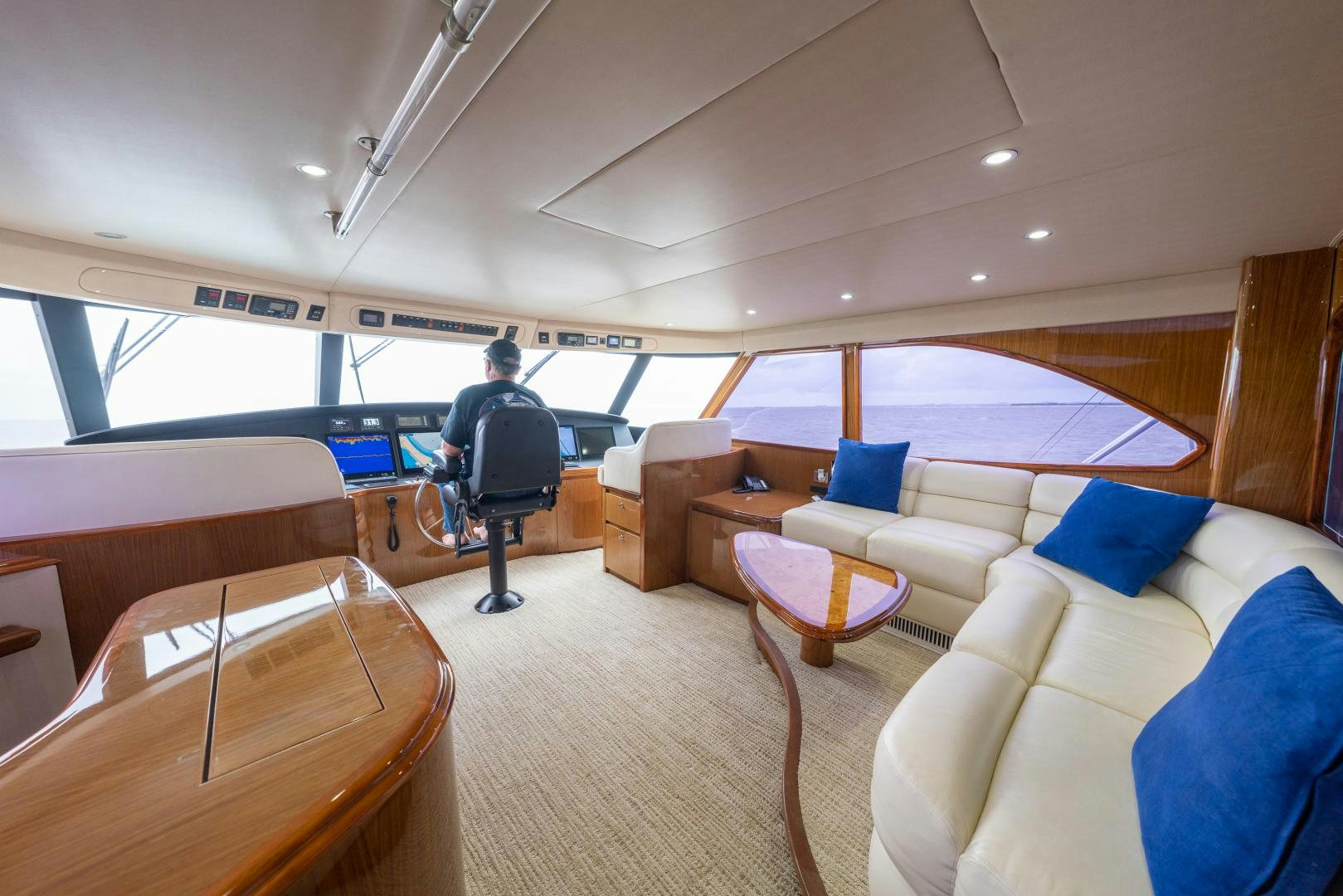 a person sitting in a room aboard MM CRICKET Yacht for Sale