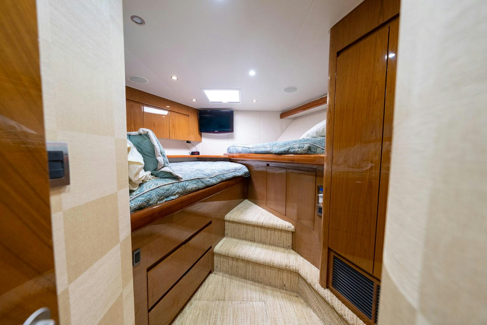 a room with a bed and a door aboard MM CRICKET Yacht for Sale