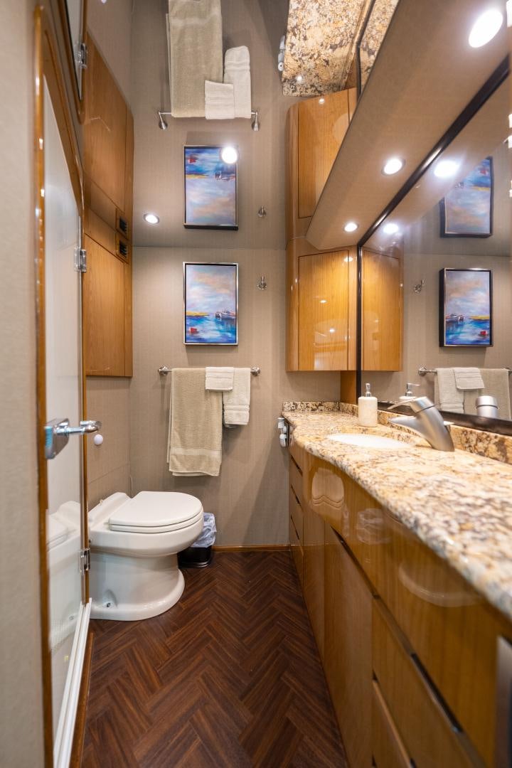 a bathroom with a toilet and sink aboard MM CRICKET Yacht for Sale