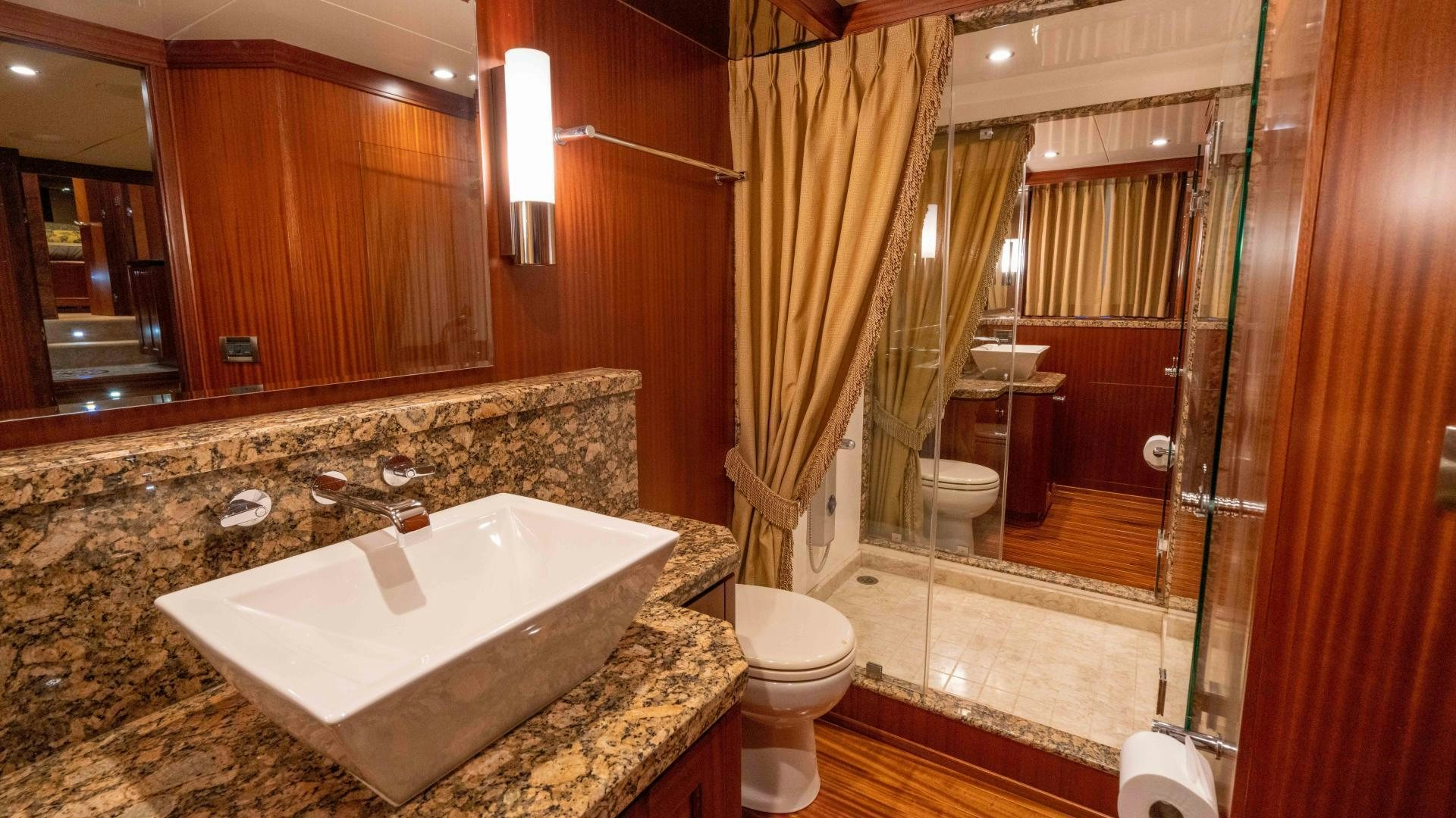 a bathroom with a tub sink and toilet aboard RHYTHM'N BLUES Yacht for Sale
