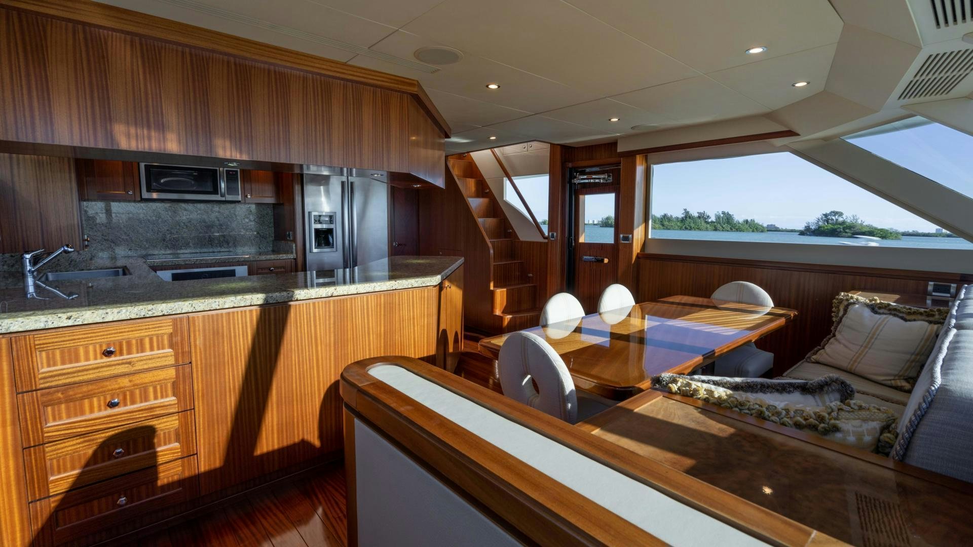 a kitchen with a table and chairs aboard RHYTHM'N BLUES Yacht for Sale