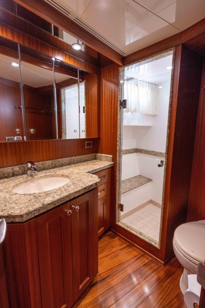 a bathroom with a sink and a mirror aboard RHYTHM'N BLUES Yacht for Sale