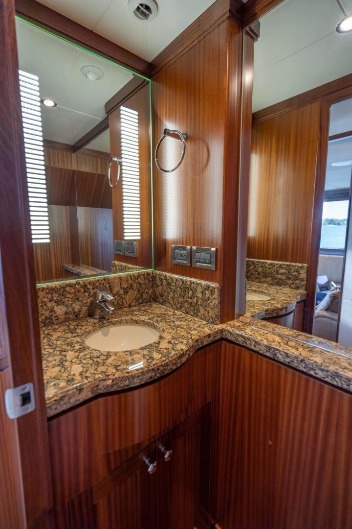 a bathroom with a countertop sink and a mirror aboard RHYTHM'N BLUES Yacht for Sale
