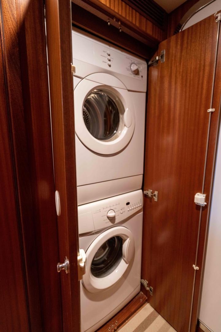 a closet with a washing machine aboard RHYTHM'N BLUES Yacht for Sale