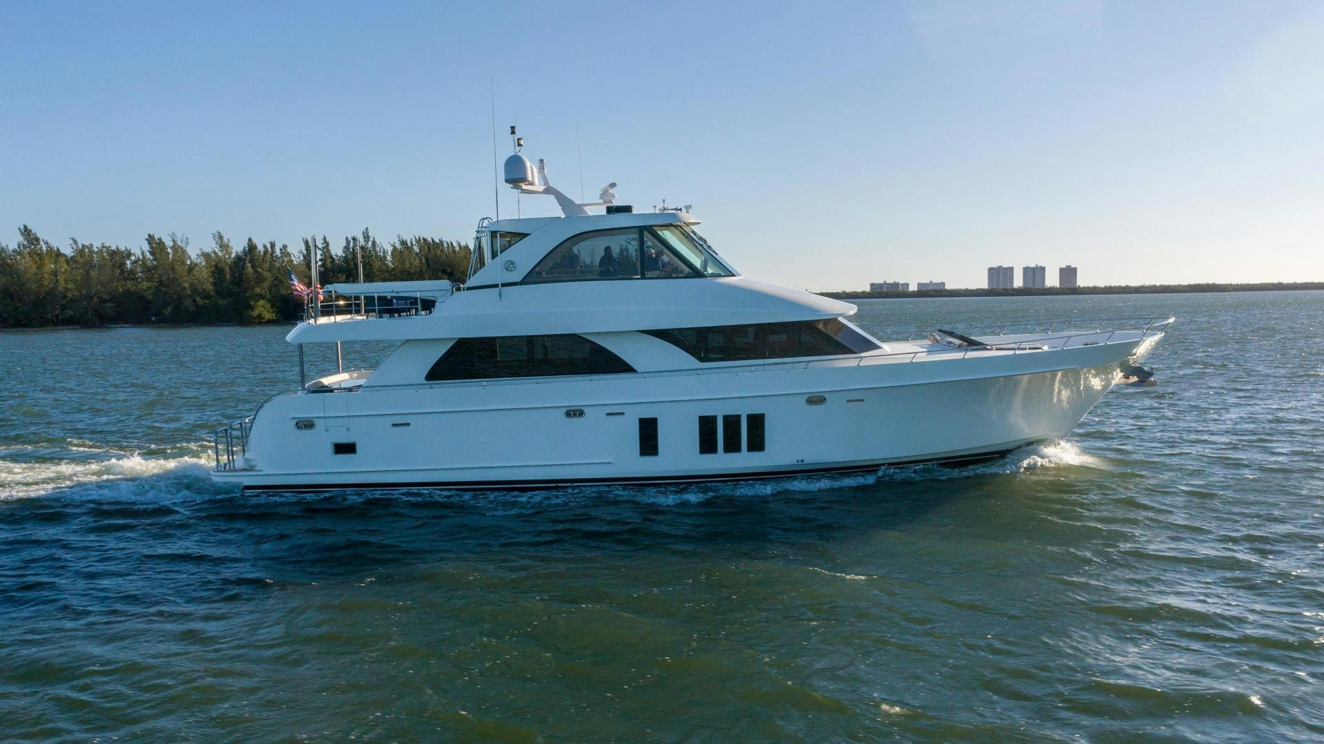 a white yacht on the water aboard RHYTHM'N BLUES Yacht for Sale