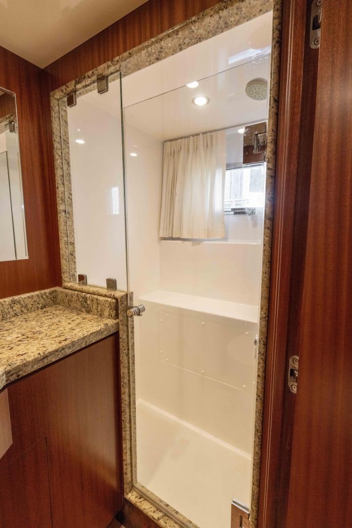 a bathroom with a shower and sink aboard RHYTHM'N BLUES Yacht for Sale