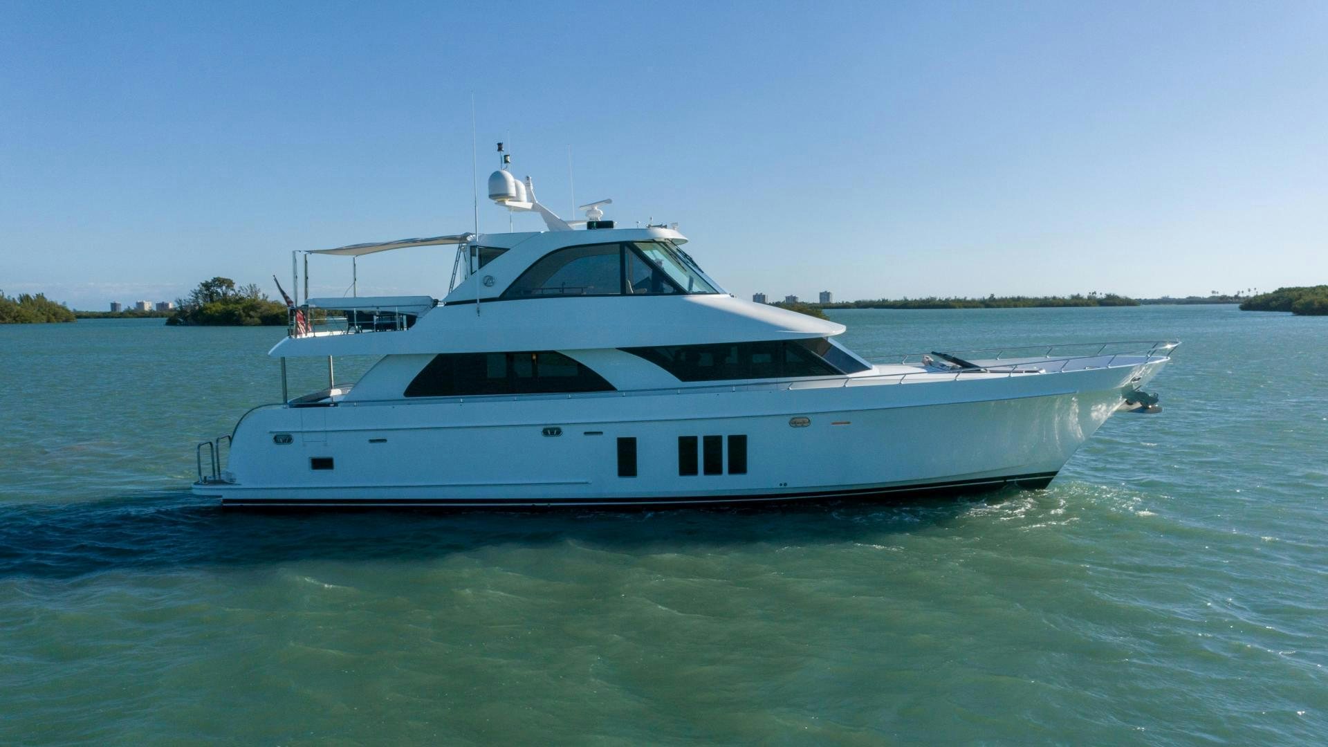 a white yacht in the water aboard RHYTHM'N BLUES Yacht for Sale