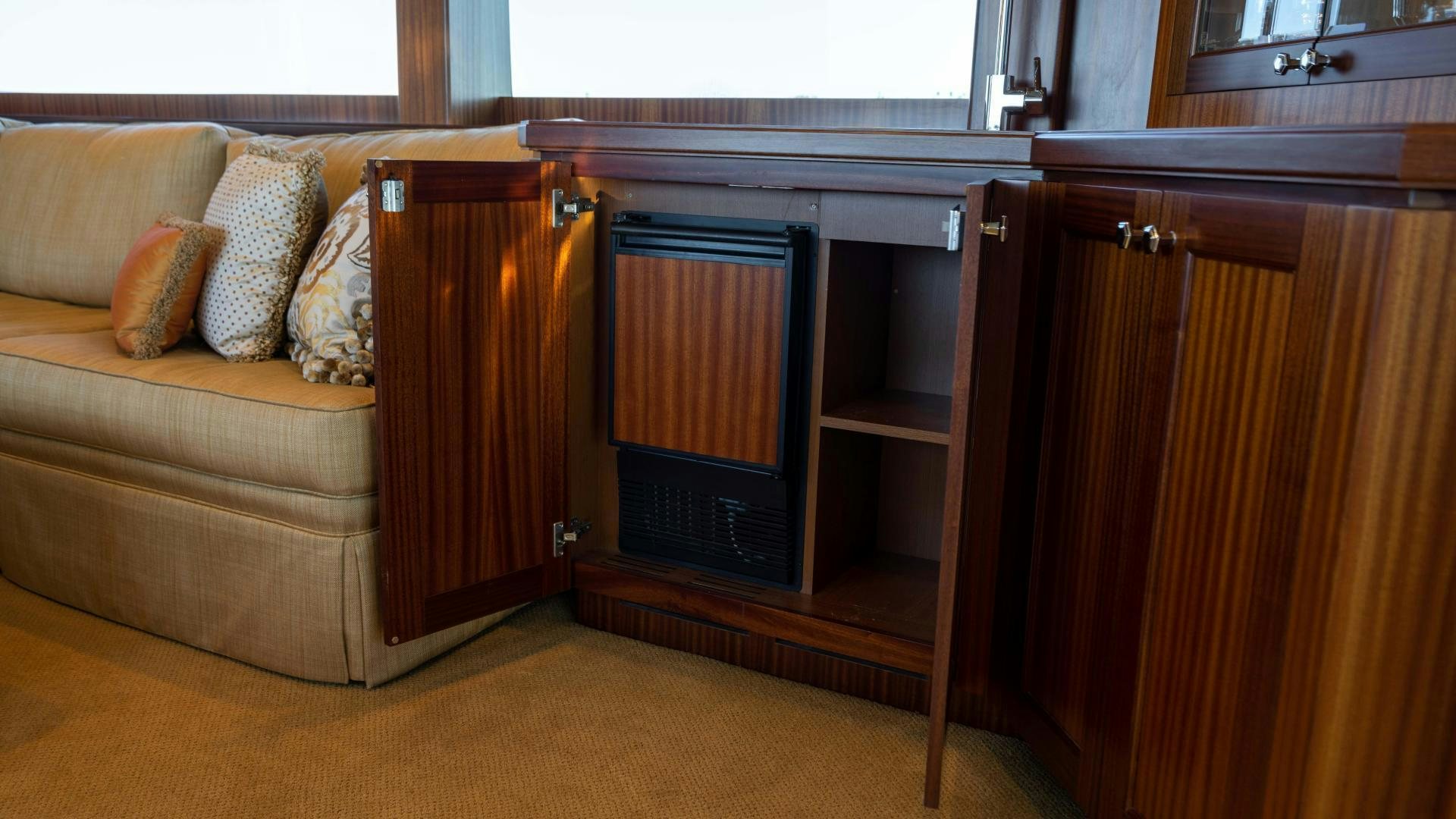 a living room with a couch and a shelf aboard RHYTHM'N BLUES Yacht for Sale
