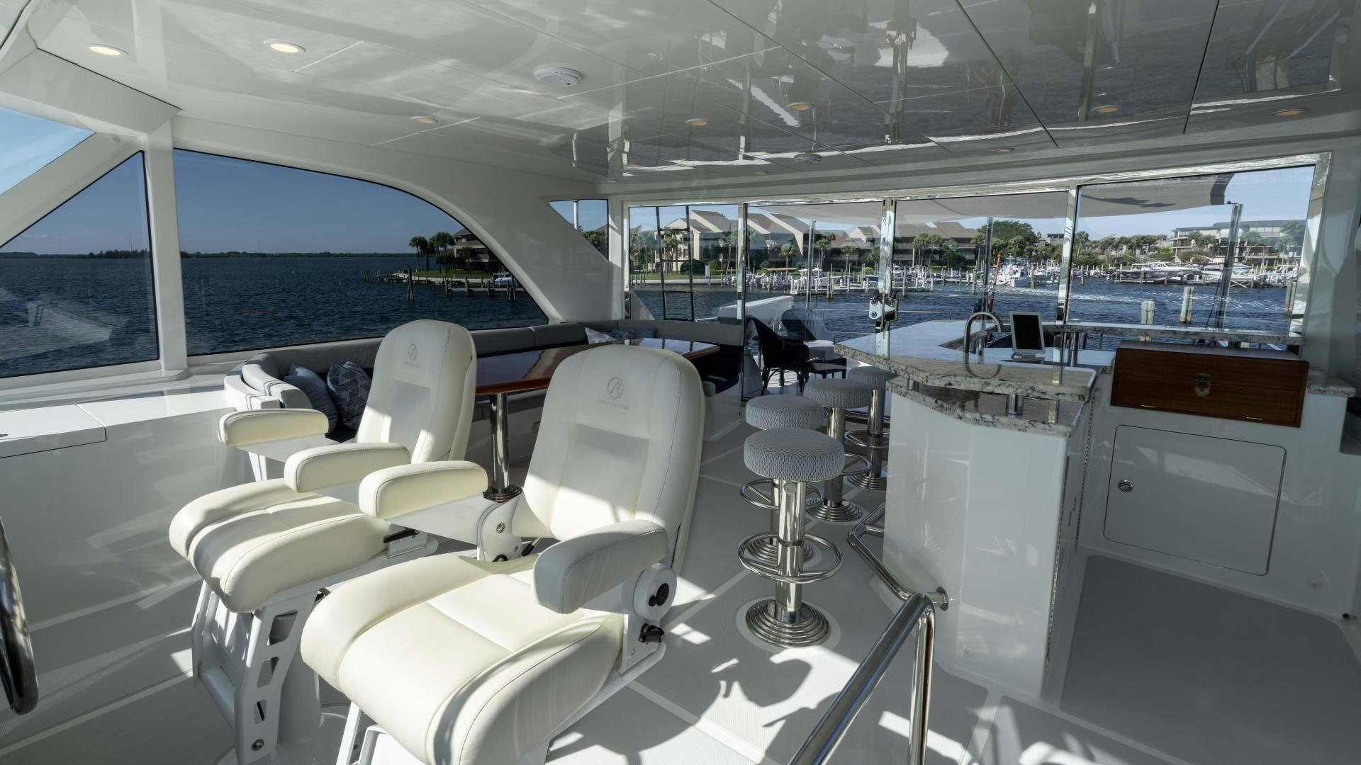 a room with a view of the ocean and the deck aboard RHYTHM'N BLUES Yacht for Sale