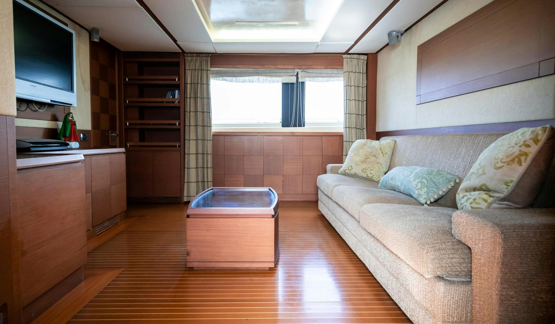 a living room with a couch and a tv aboard CAMY ED Yacht for Sale
