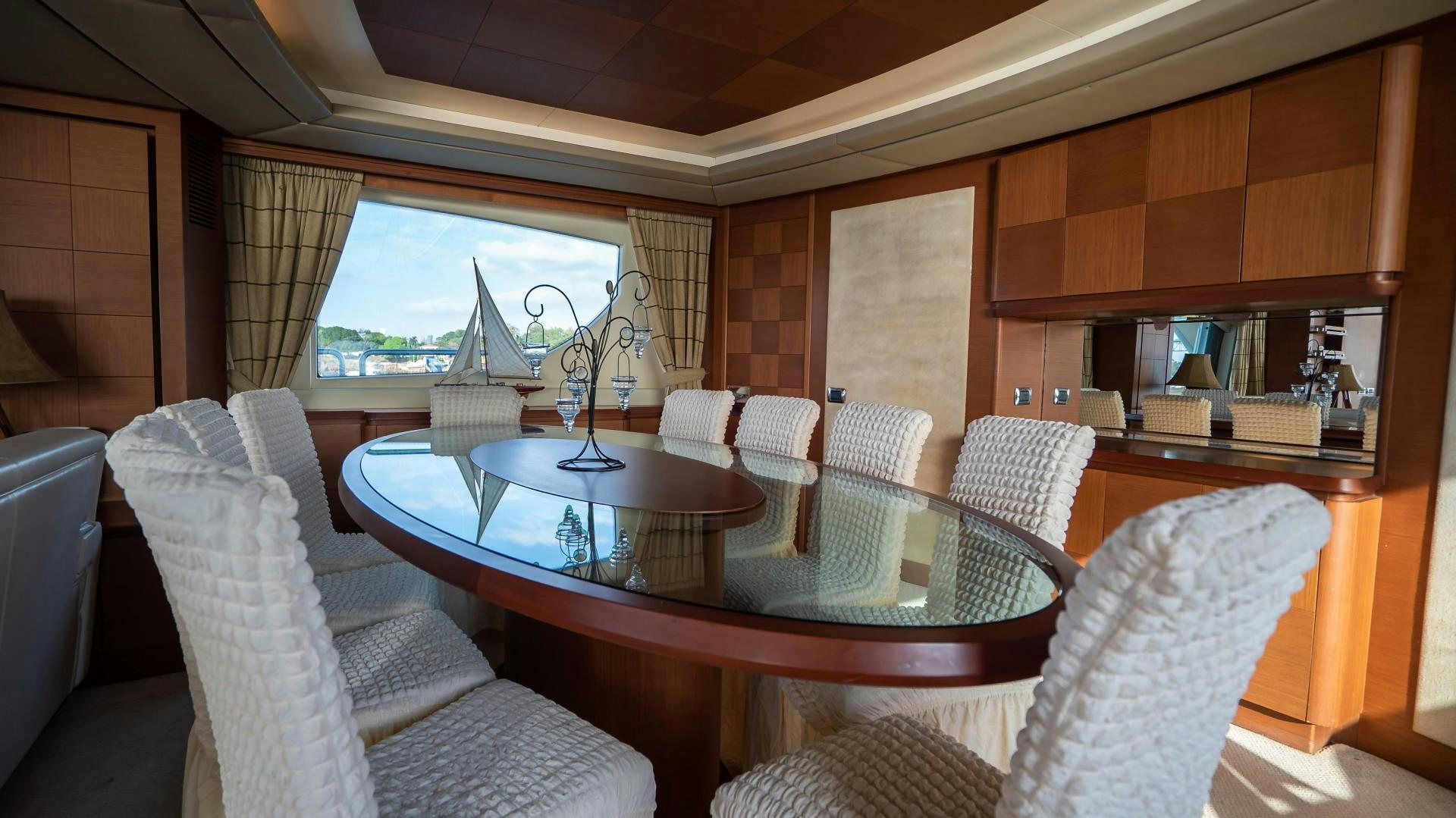 a dining room with a table and chairs aboard CAMY ED Yacht for Sale