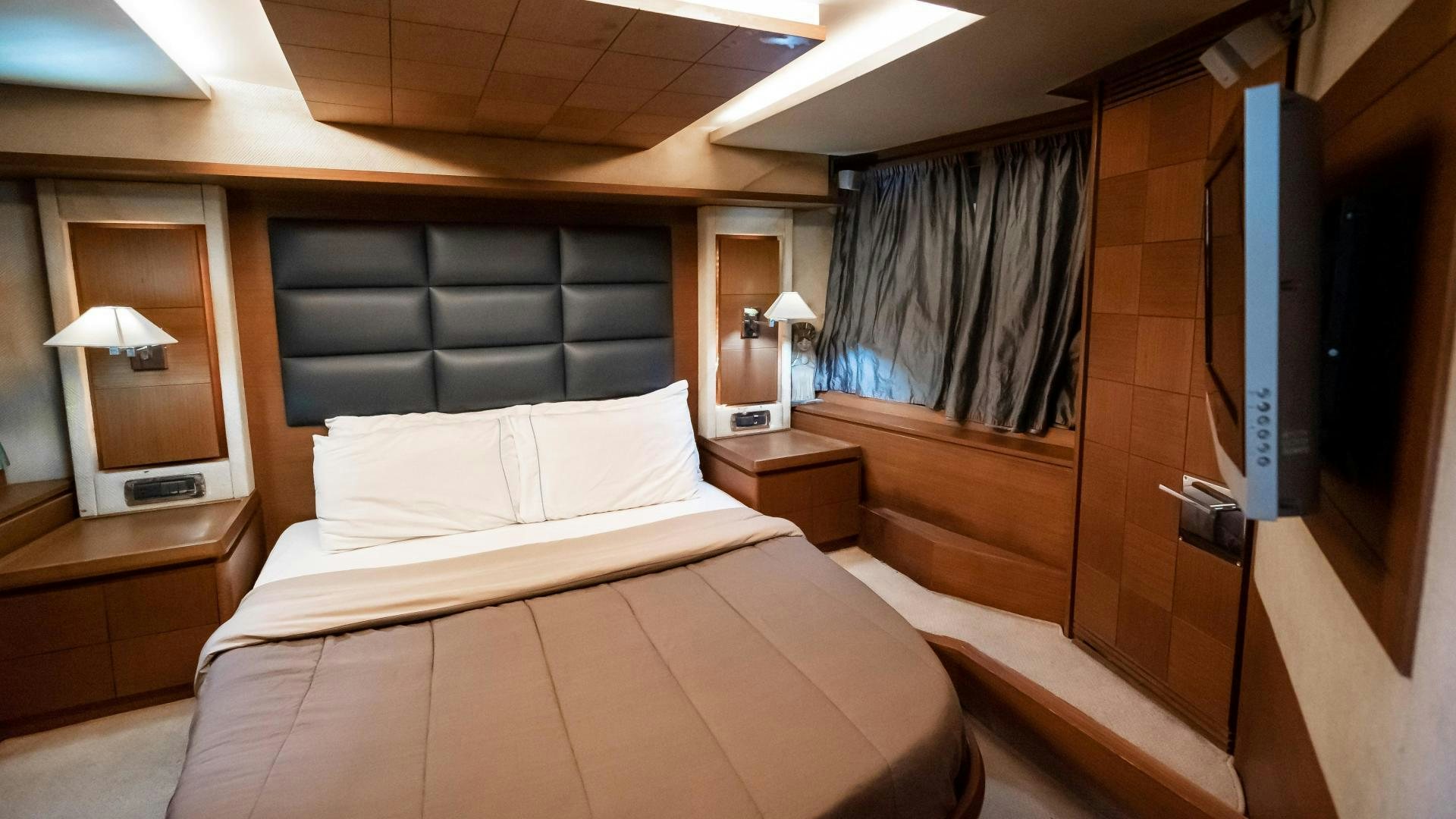 a room with a bed and a tv aboard CAMY ED Yacht for Sale