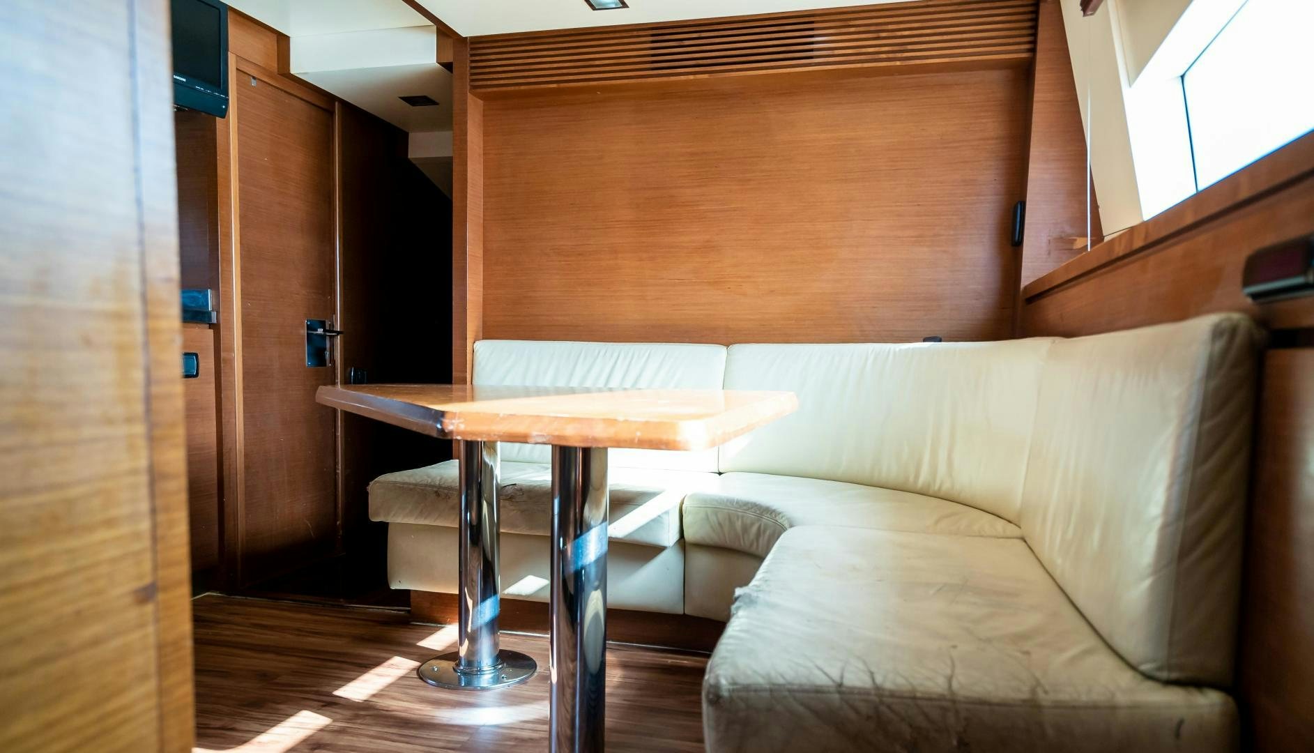 a bed and a table in a room aboard CAMY ED Yacht for Sale