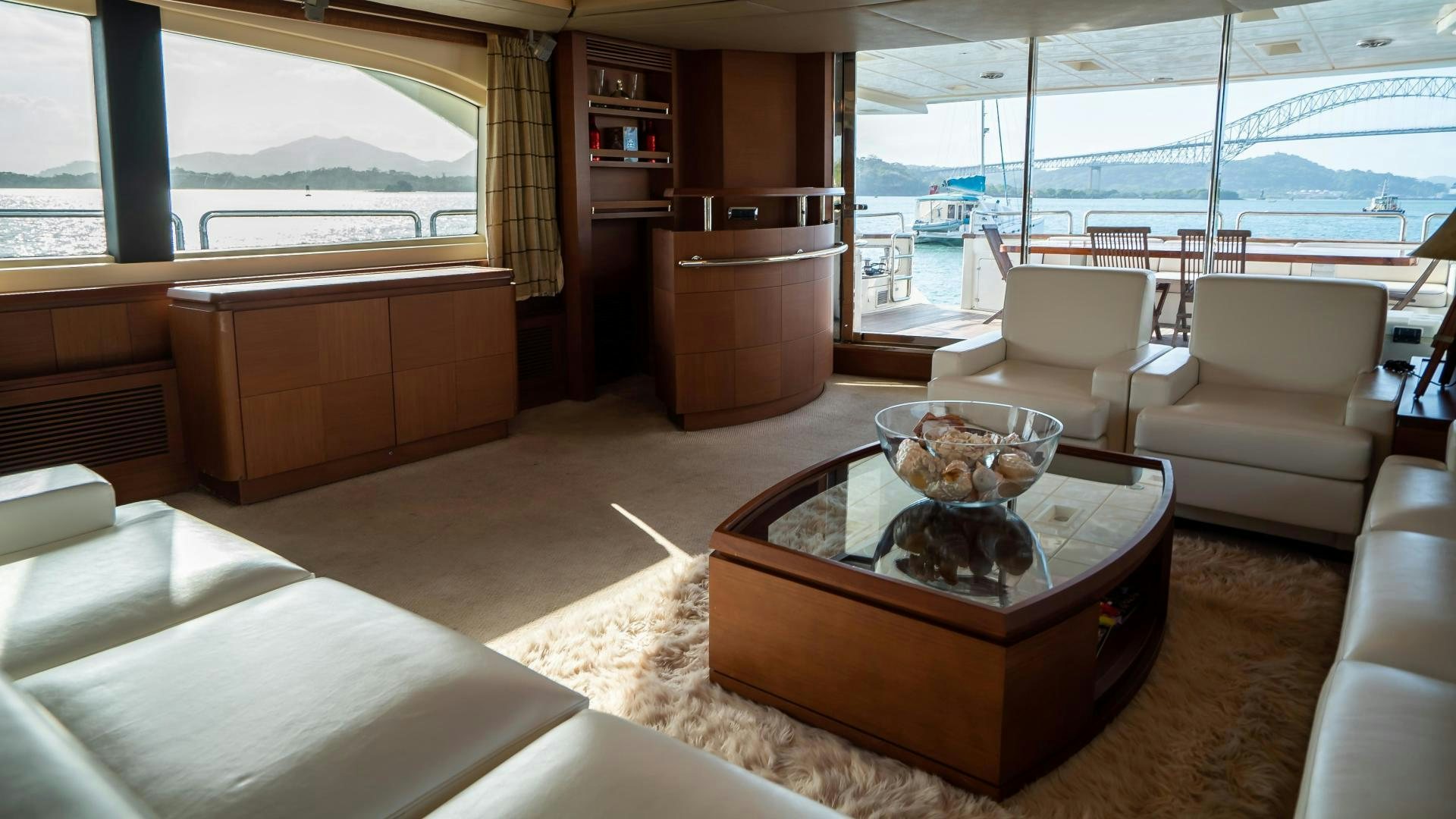 a living room with a large window aboard CAMY ED Yacht for Sale