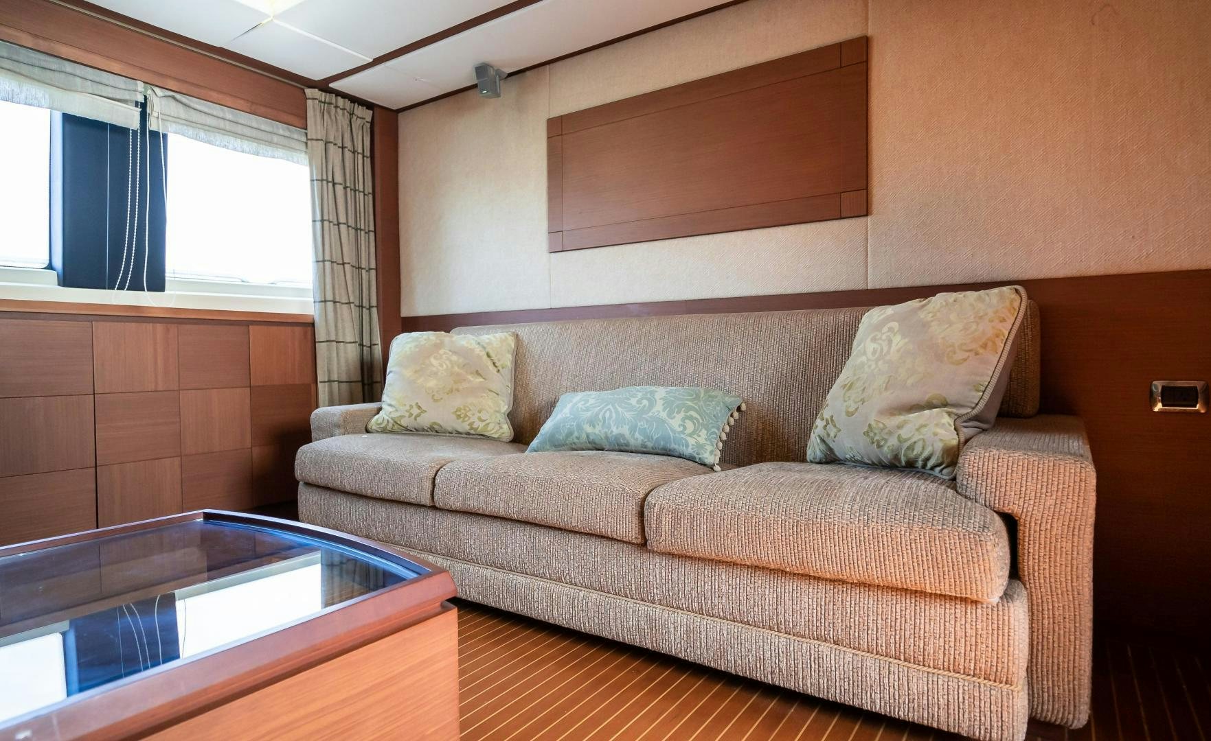 a couch with pillows on it aboard CAMY ED Yacht for Sale