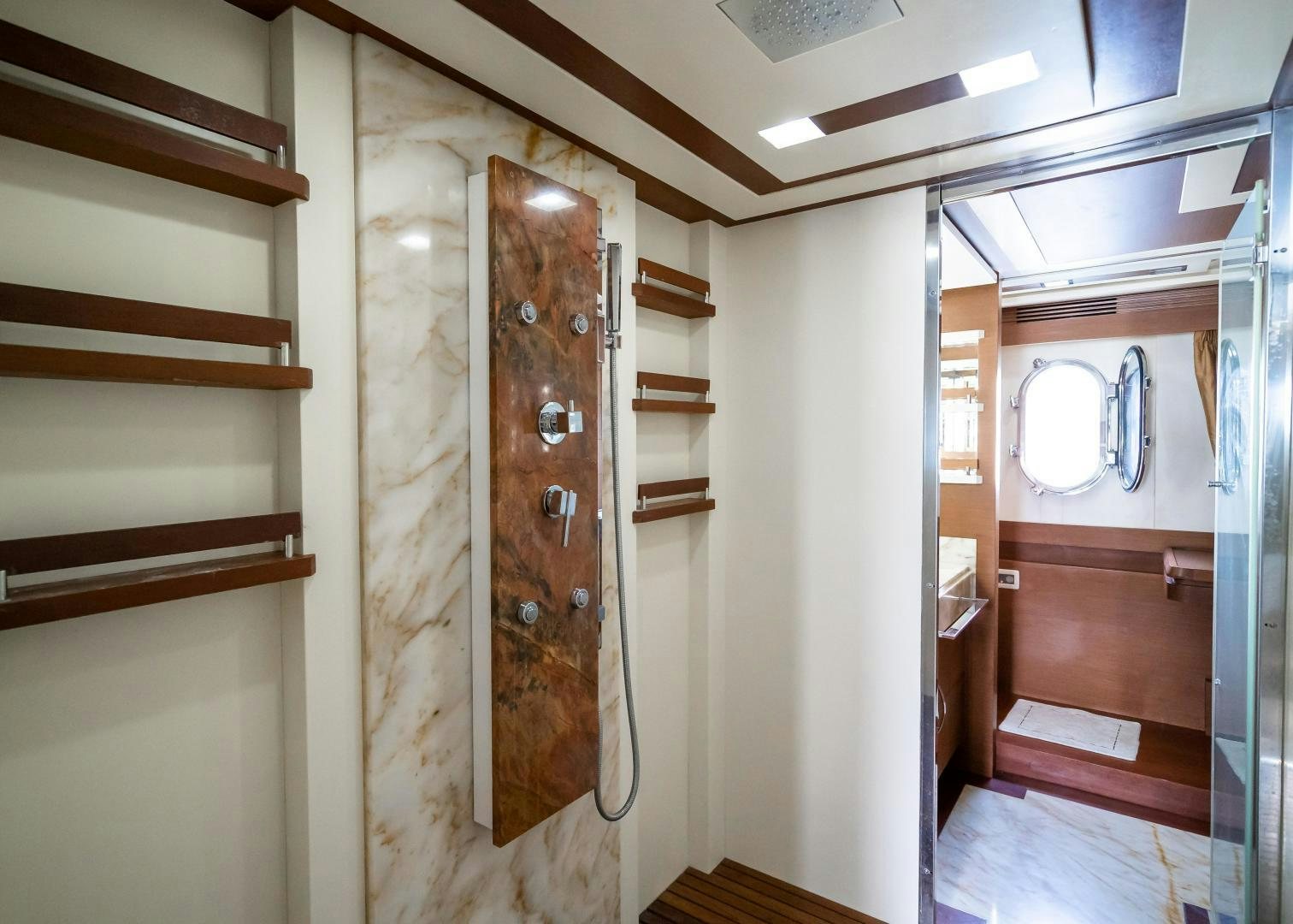 a room with a wood door and a mirror aboard CAMY ED Yacht for Sale