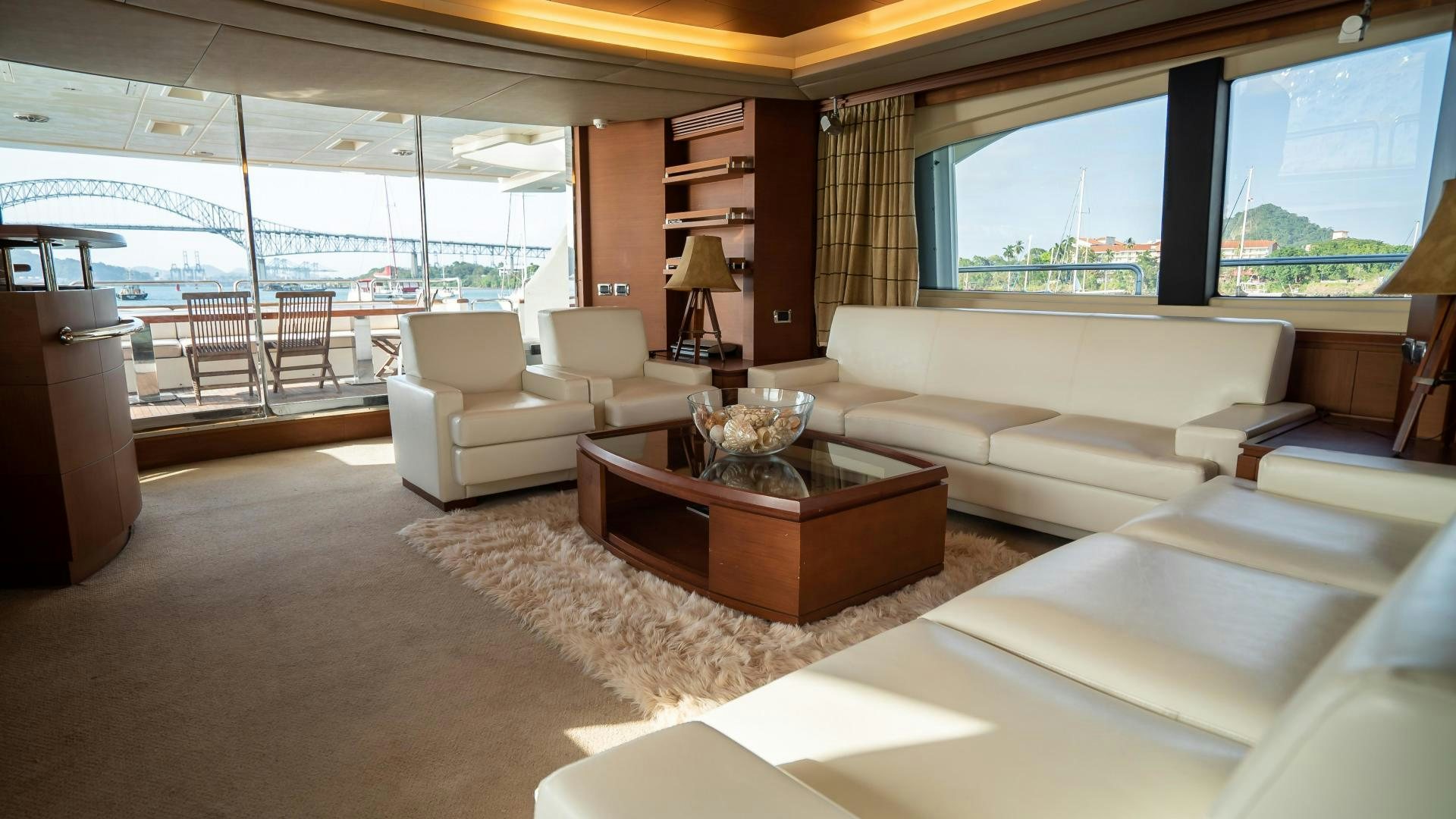 a living room with a large window aboard CAMY ED Yacht for Sale