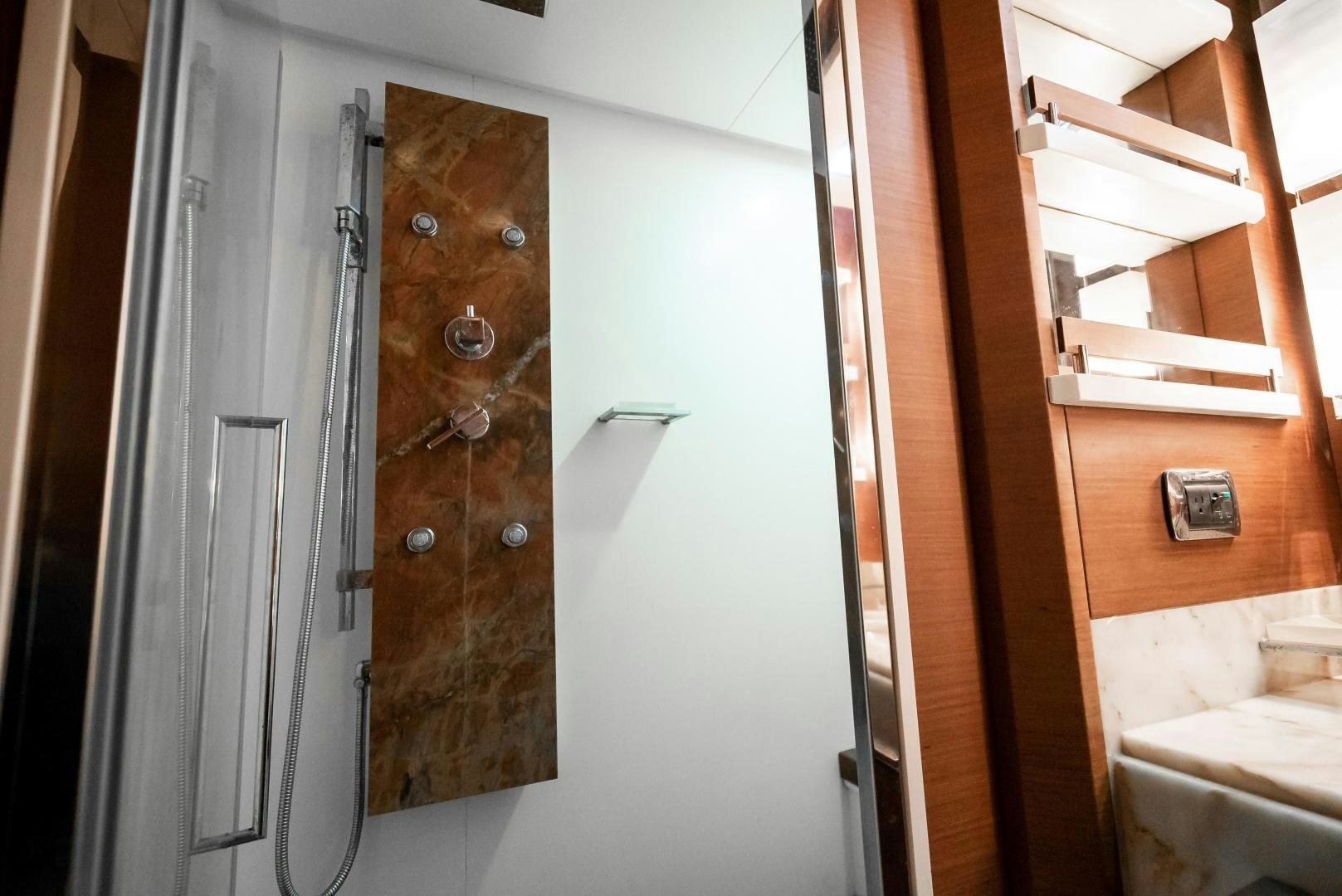 a closet with a door open aboard CAMY ED Yacht for Sale