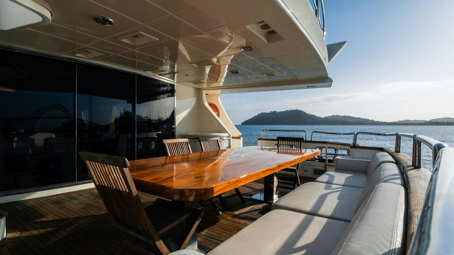 a table and chairs on a boat aboard CAMY ED Yacht for Sale