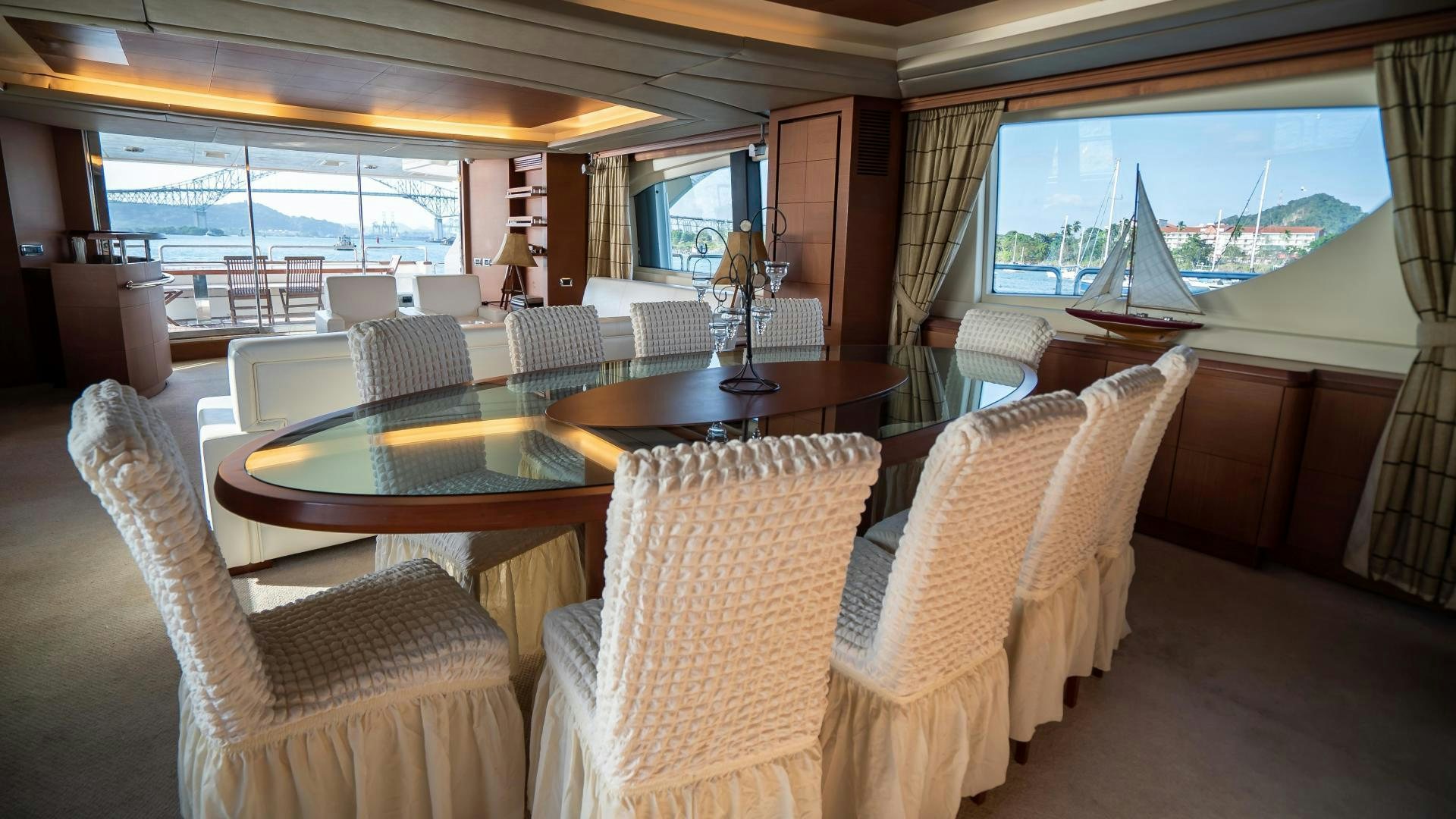 a room with a table chairs and a window aboard CAMY ED Yacht for Sale
